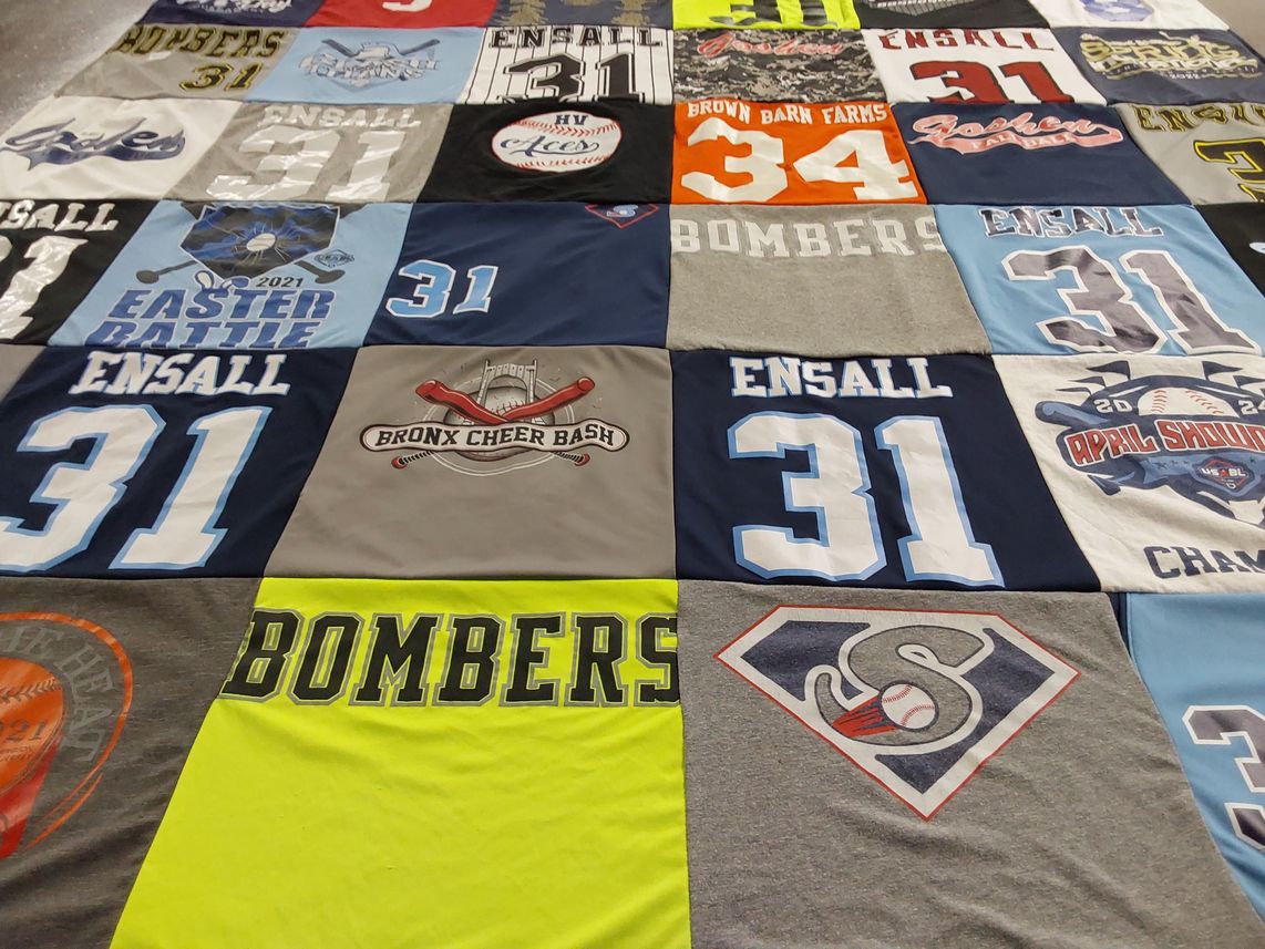 T-shirt quilt with sports, cheerleading themes by Leslie from NY