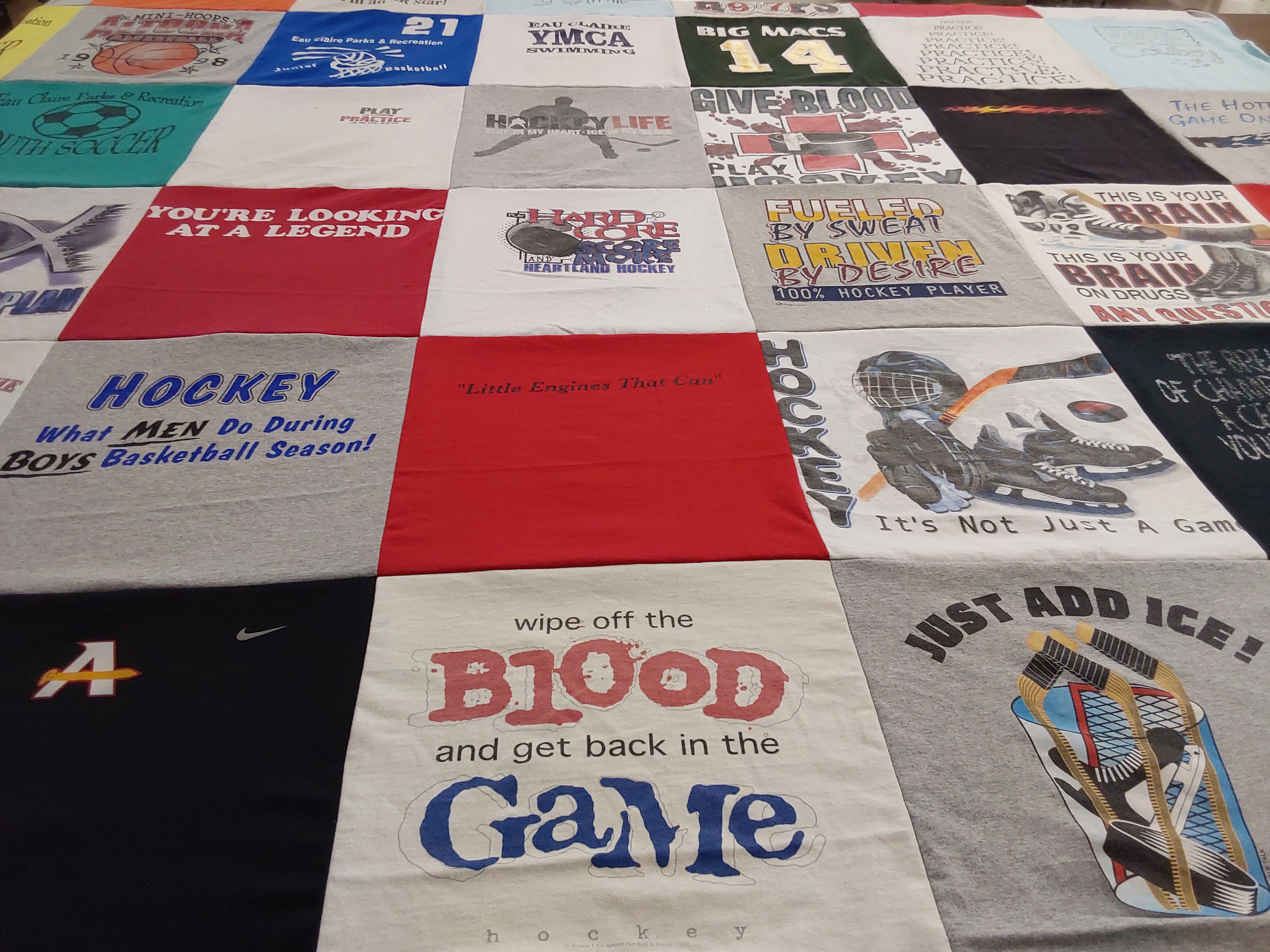 T-shirt quilt with hockey, basketball themes by Vicky from AL