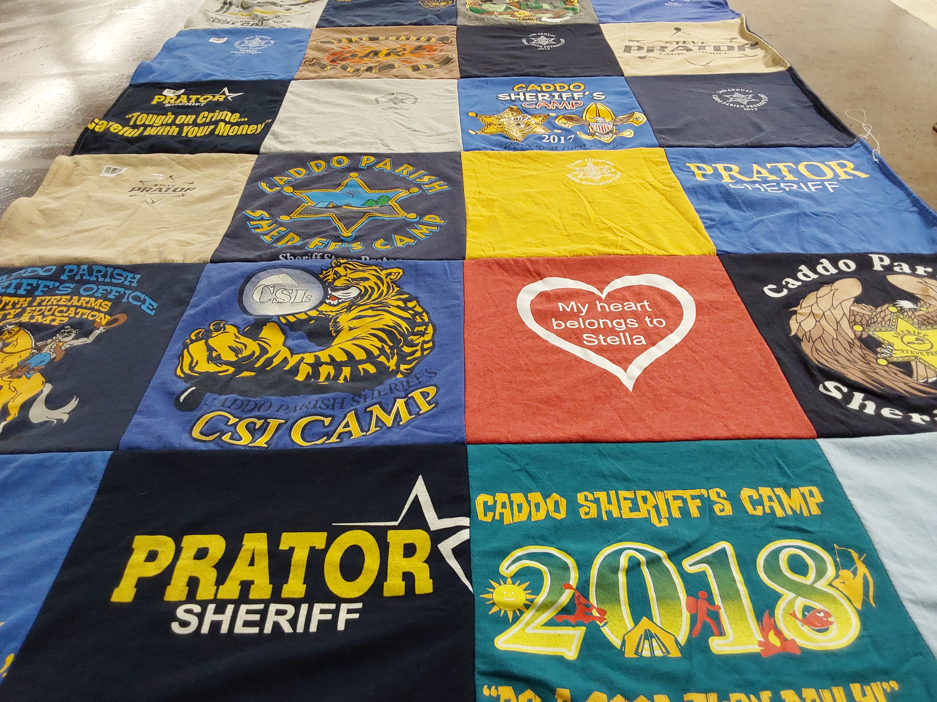 T-shirt quilt with law enforcement, education themes by Steve from LA