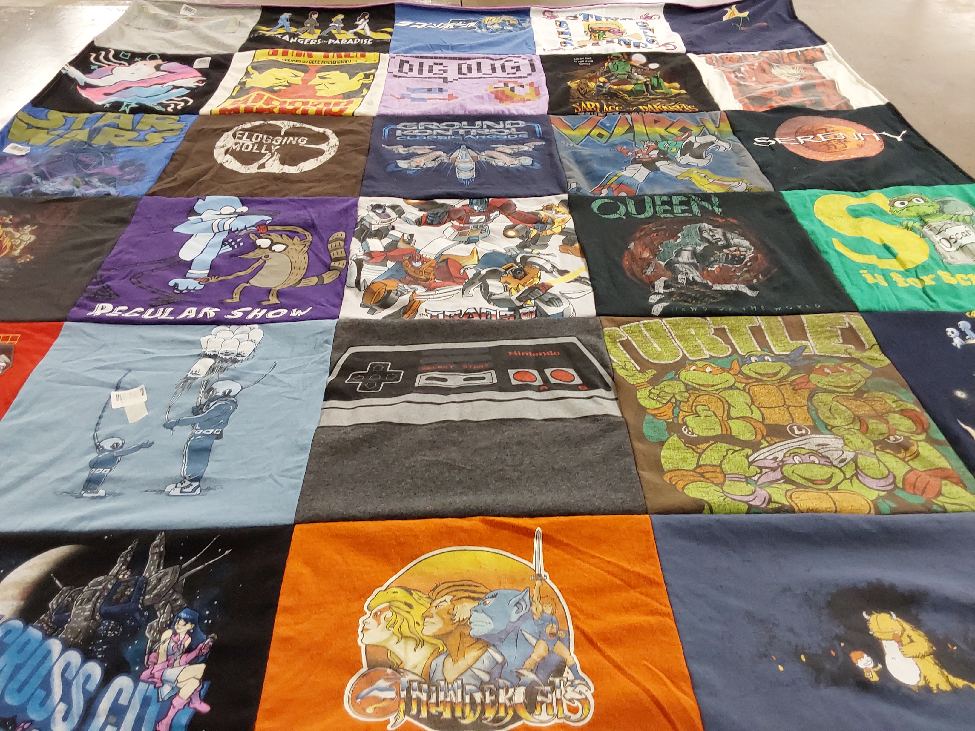 T-shirt quilt with anime, gaming themes by Claire from NM