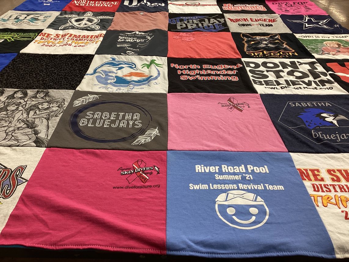 T-shirt quilt featuring sabetha bluejays, north eugene high school swim team by V Margaret from OR