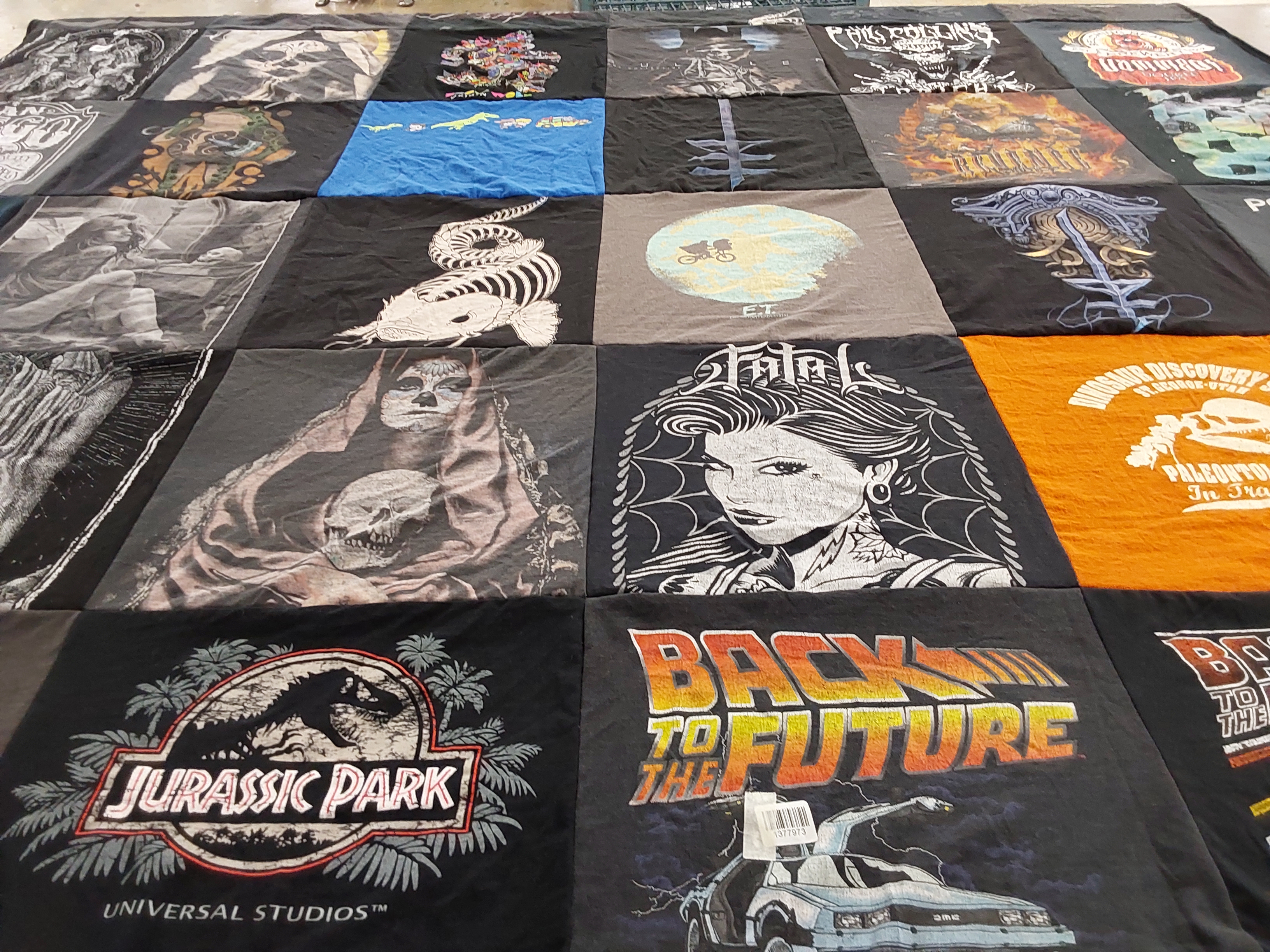 T-shirt quilt with movies, dinosaurs themes by April from NC