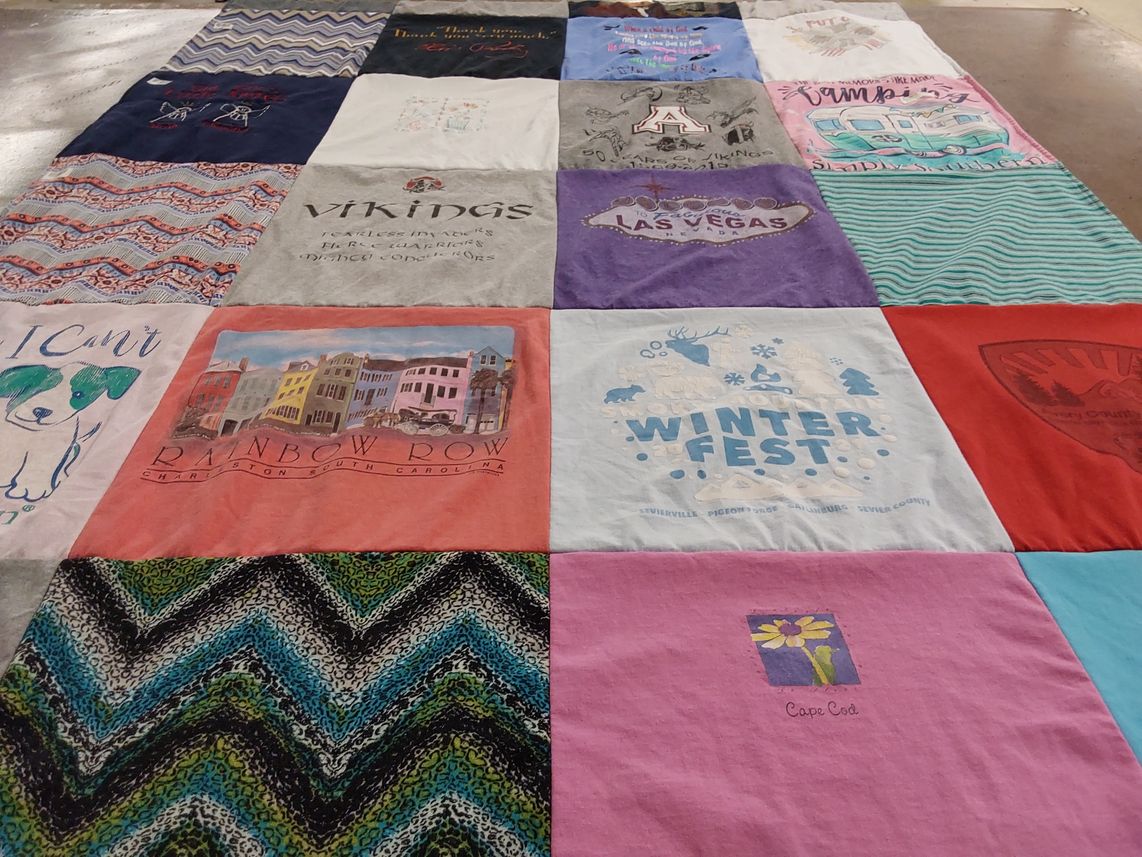 T-shirt quilt with travel, dogs themes by Kimberly from NC