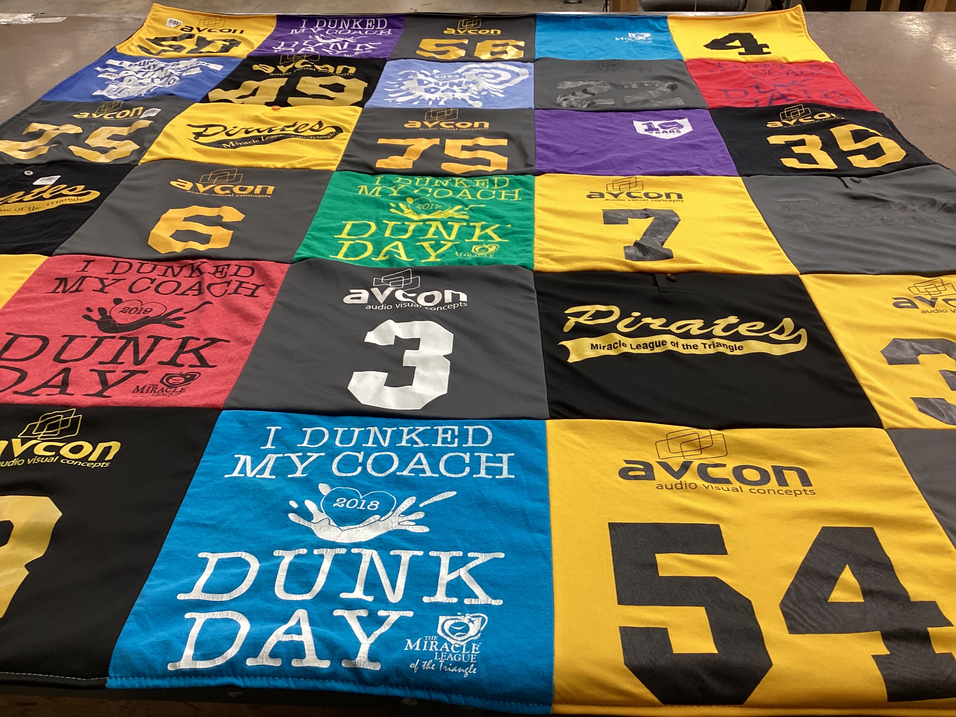 T-shirt quilt with sports, charity events themes by Martha from NC