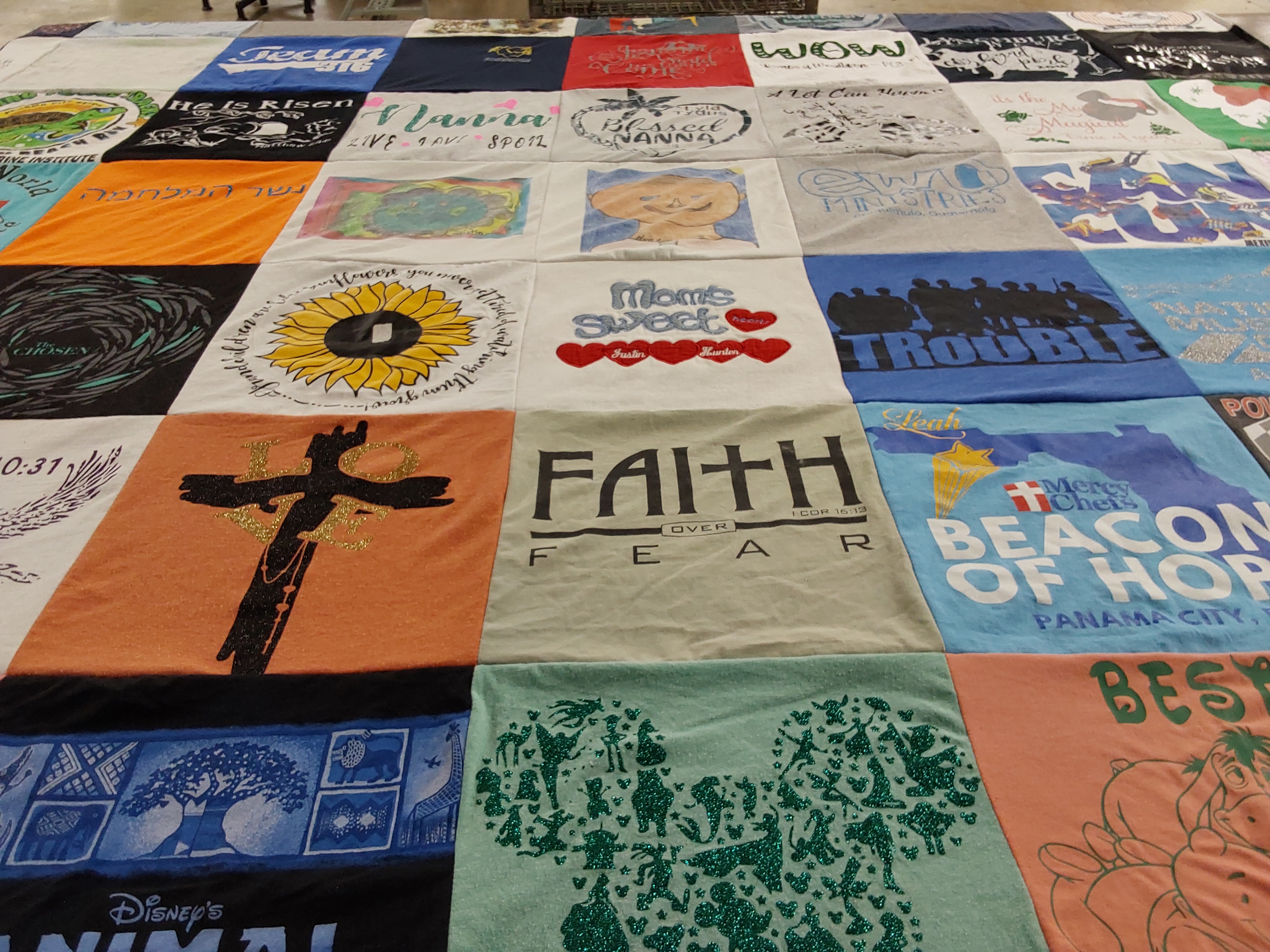 T-shirt quilt with faith, community themes by Leah from FL