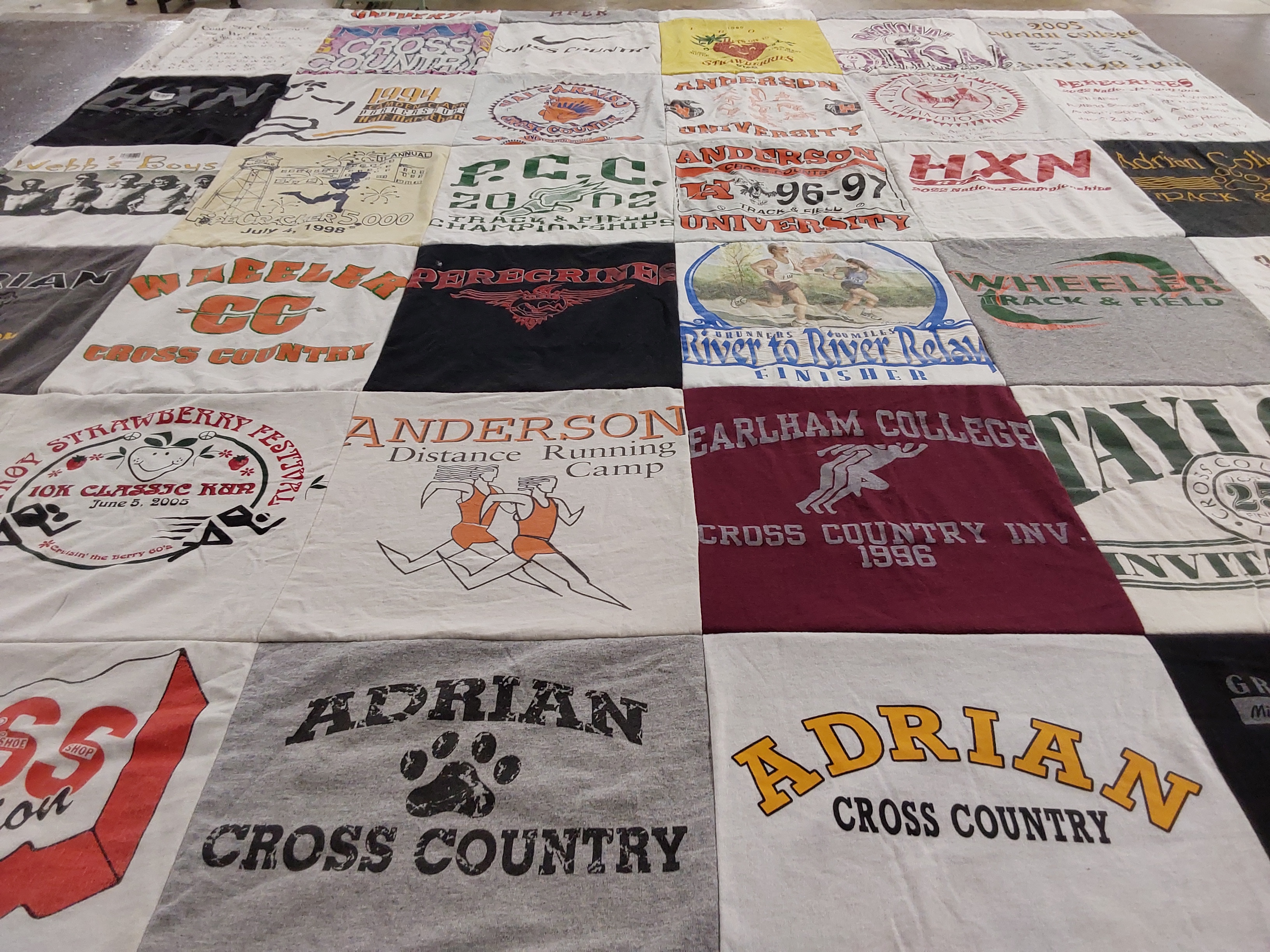 T-shirt quilt featuring adrian cross country, wheeler cross country by monica from MI