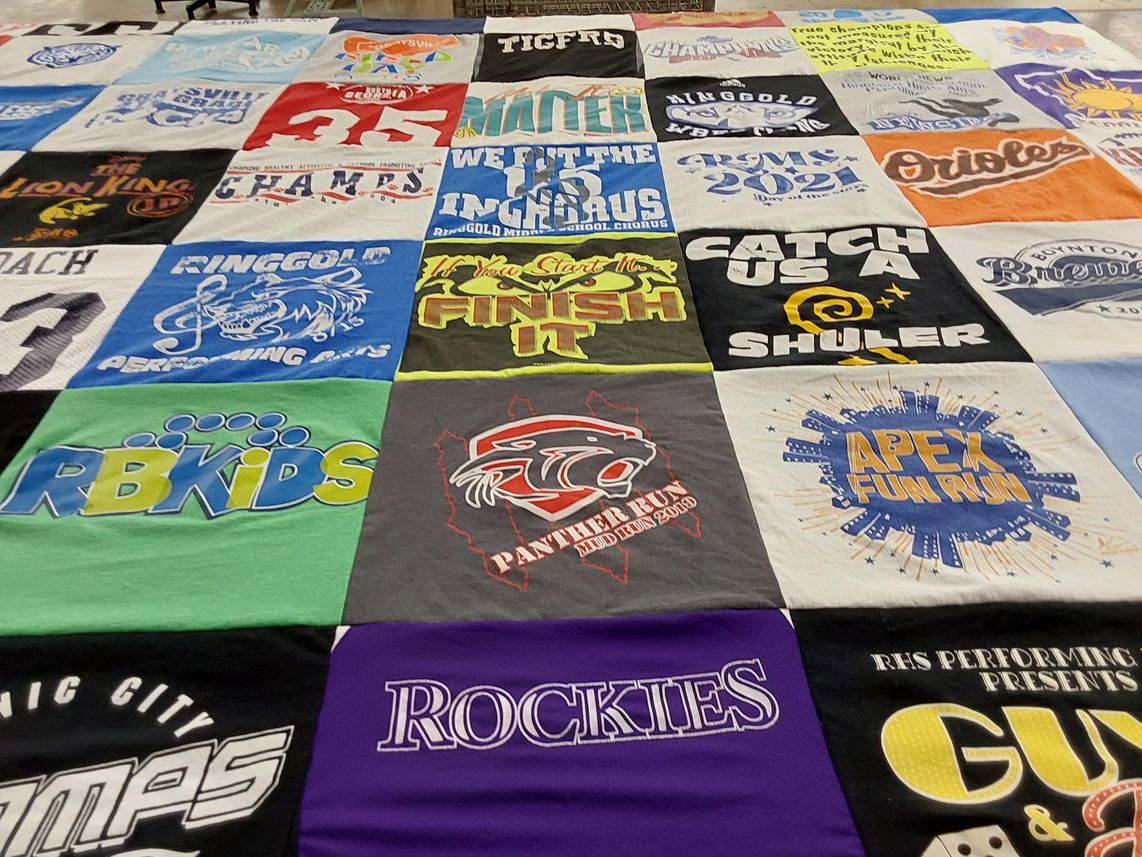 T-shirt quilt with sports, performing arts themes by Kelli from GA