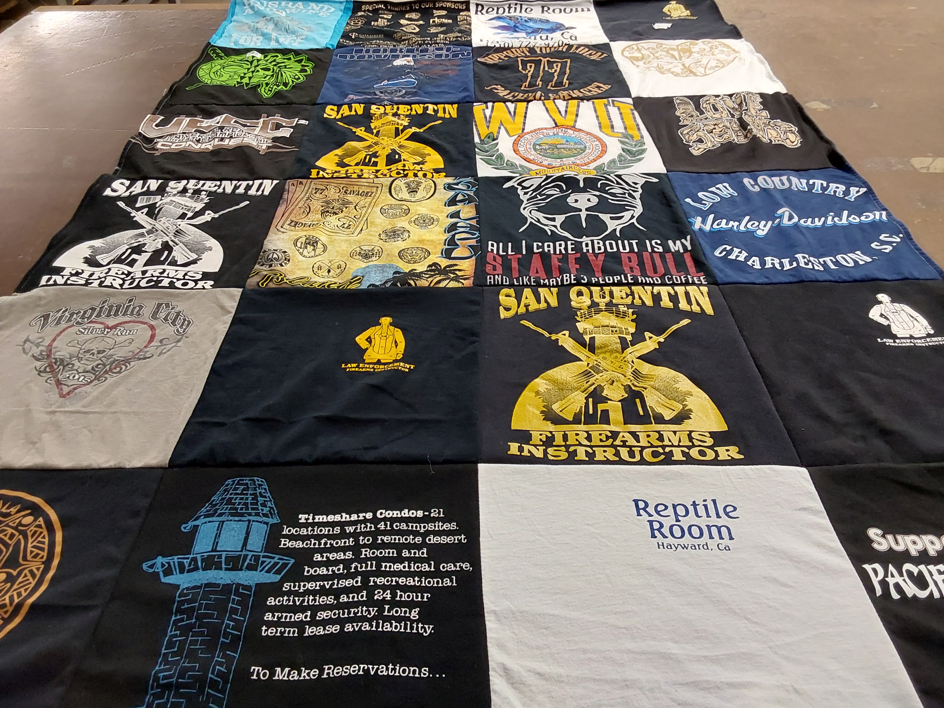 T-shirt quilt with firearms, reptiles themes by Teresa from CA