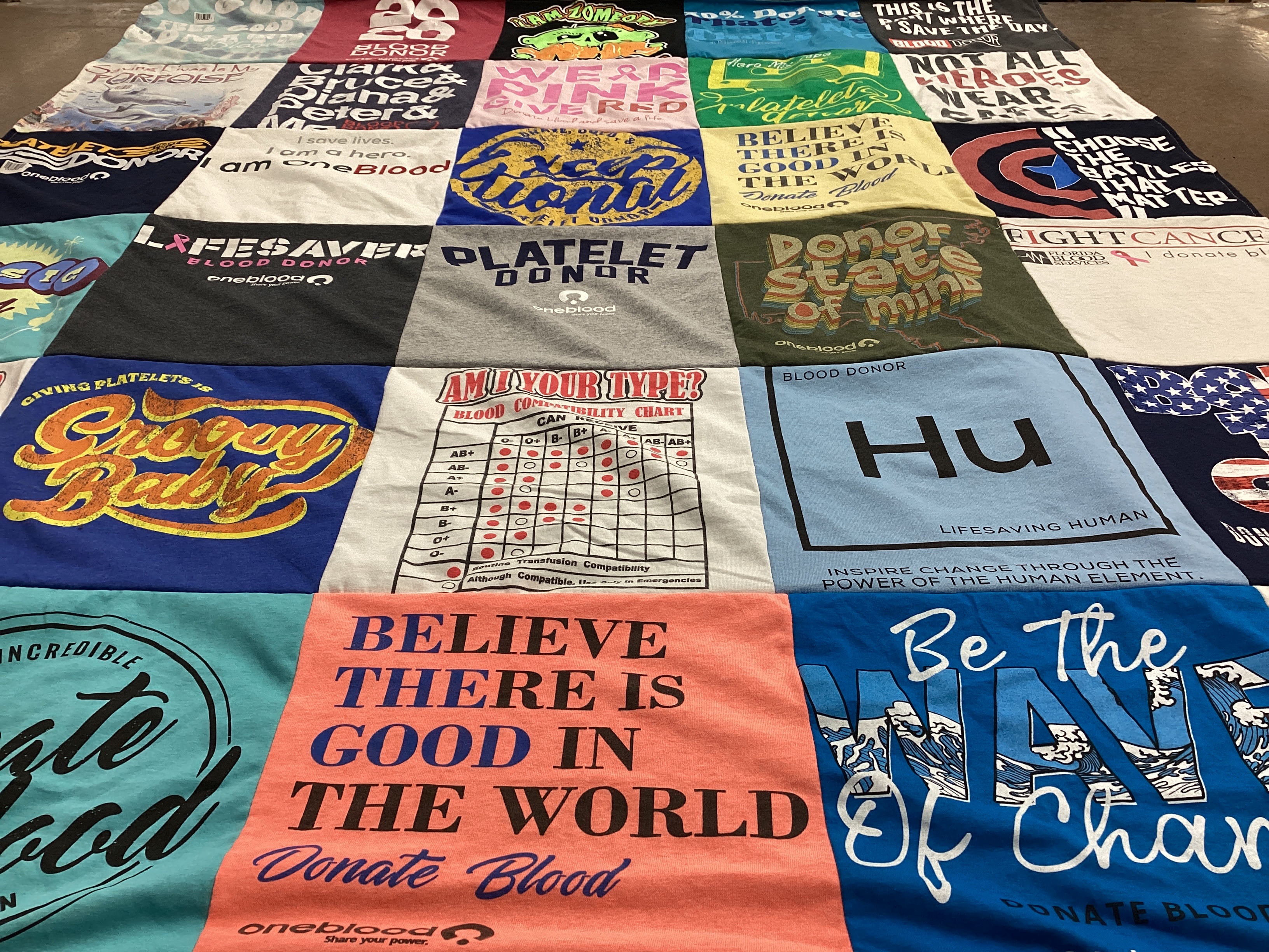 T-shirt quilt with blood donation, humanitarian efforts themes by Judy from FL