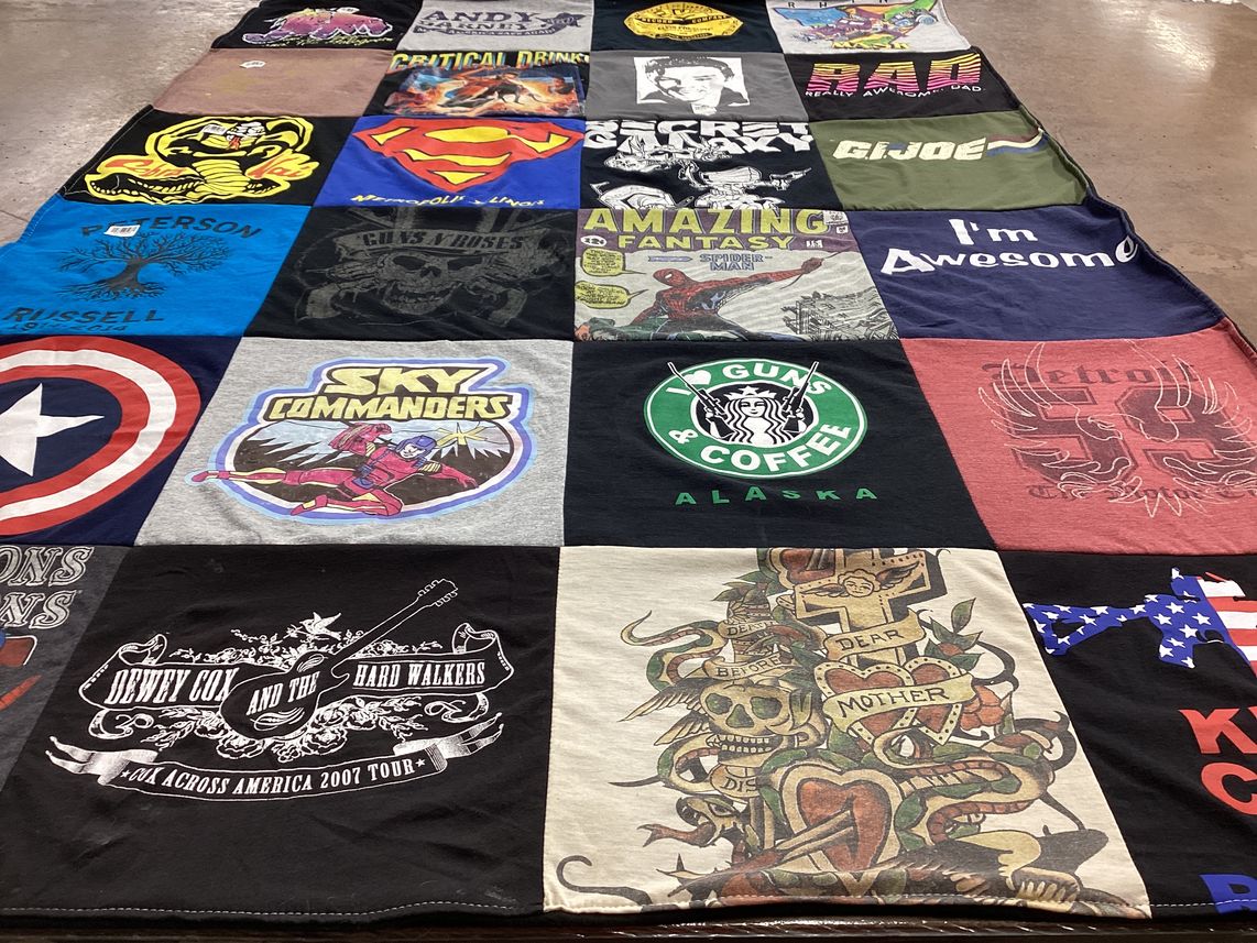 T-shirt quilt with comics, music themes by Starr from TN