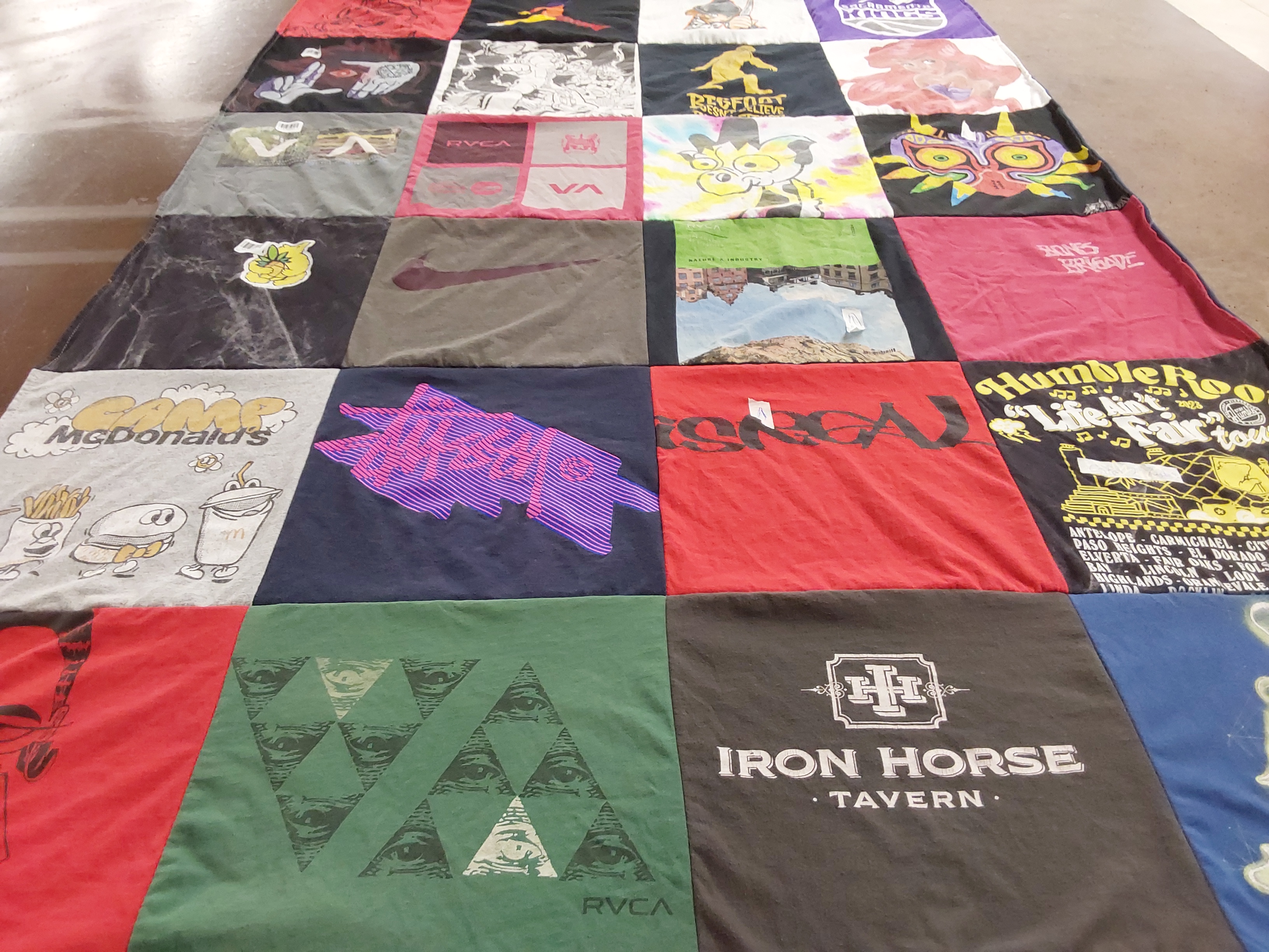 T-shirt quilt with food, music themes by Kelly from CA