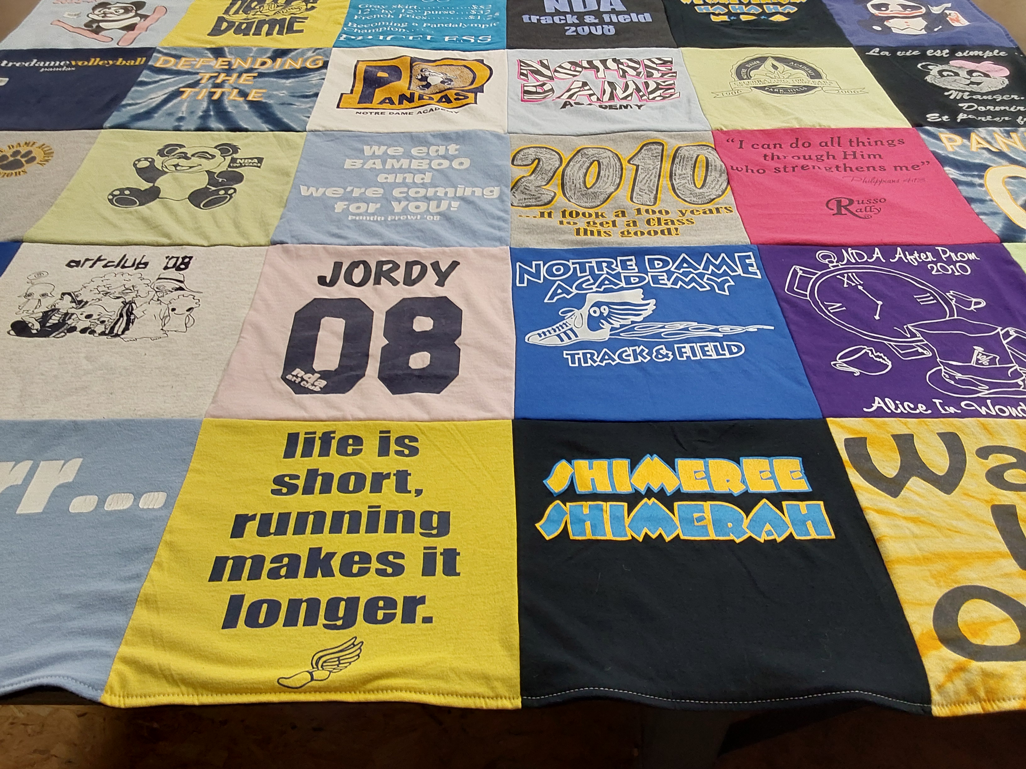 T-shirt quilt featuring notre dame academy track and field by Jordan from NC