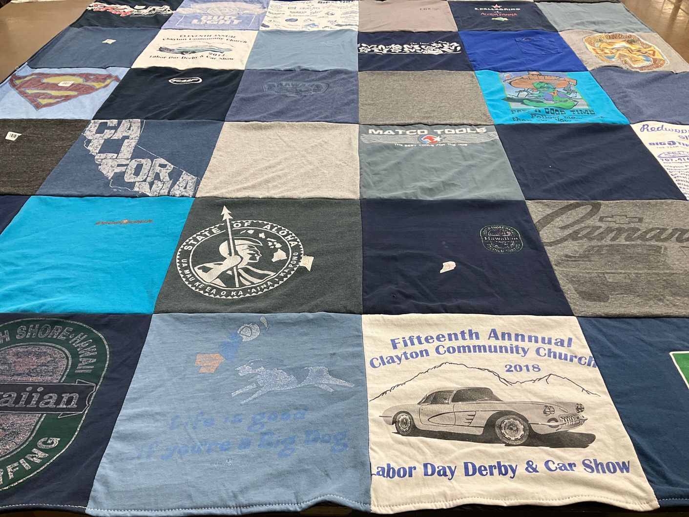T-shirt quilt with cars, community events themes by Wendy Williams  from CA