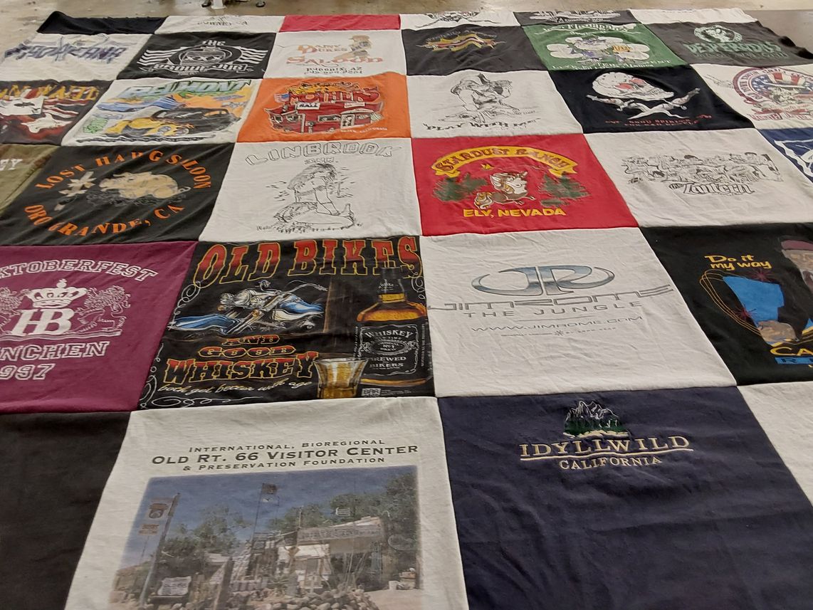 T-shirt quilt with whiskey, biking themes by Sherry from CA