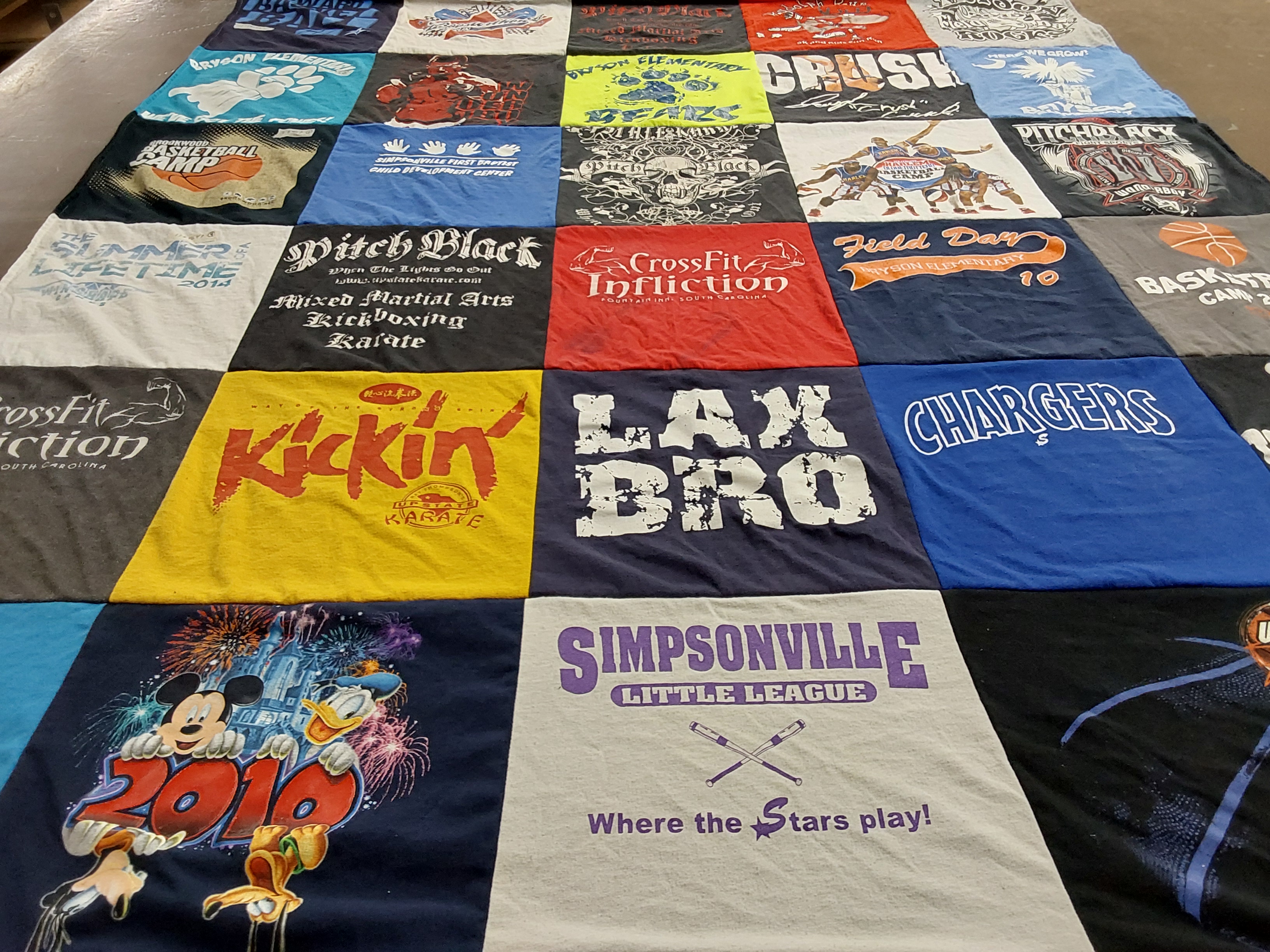 T-shirt quilt with martial arts, basketball themes by Roberta from WI