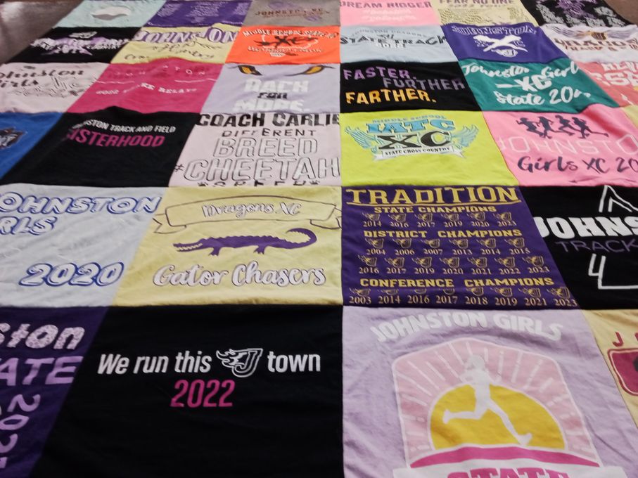 T-shirt quilt featuring johnston girls xc, johnston track team by Emily from IA