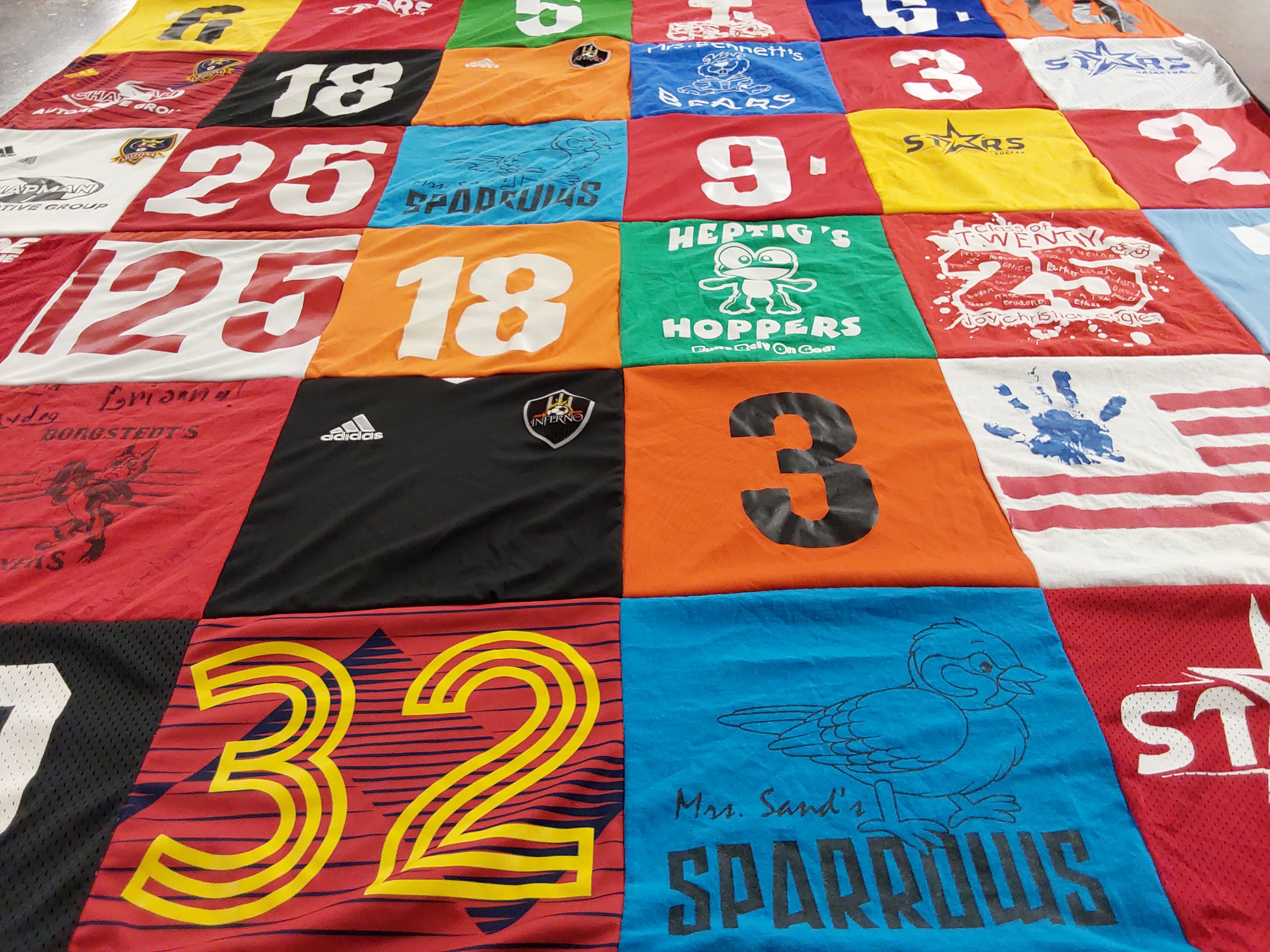 T-shirt quilt with sports, teams themes by Cheyenne from AZ