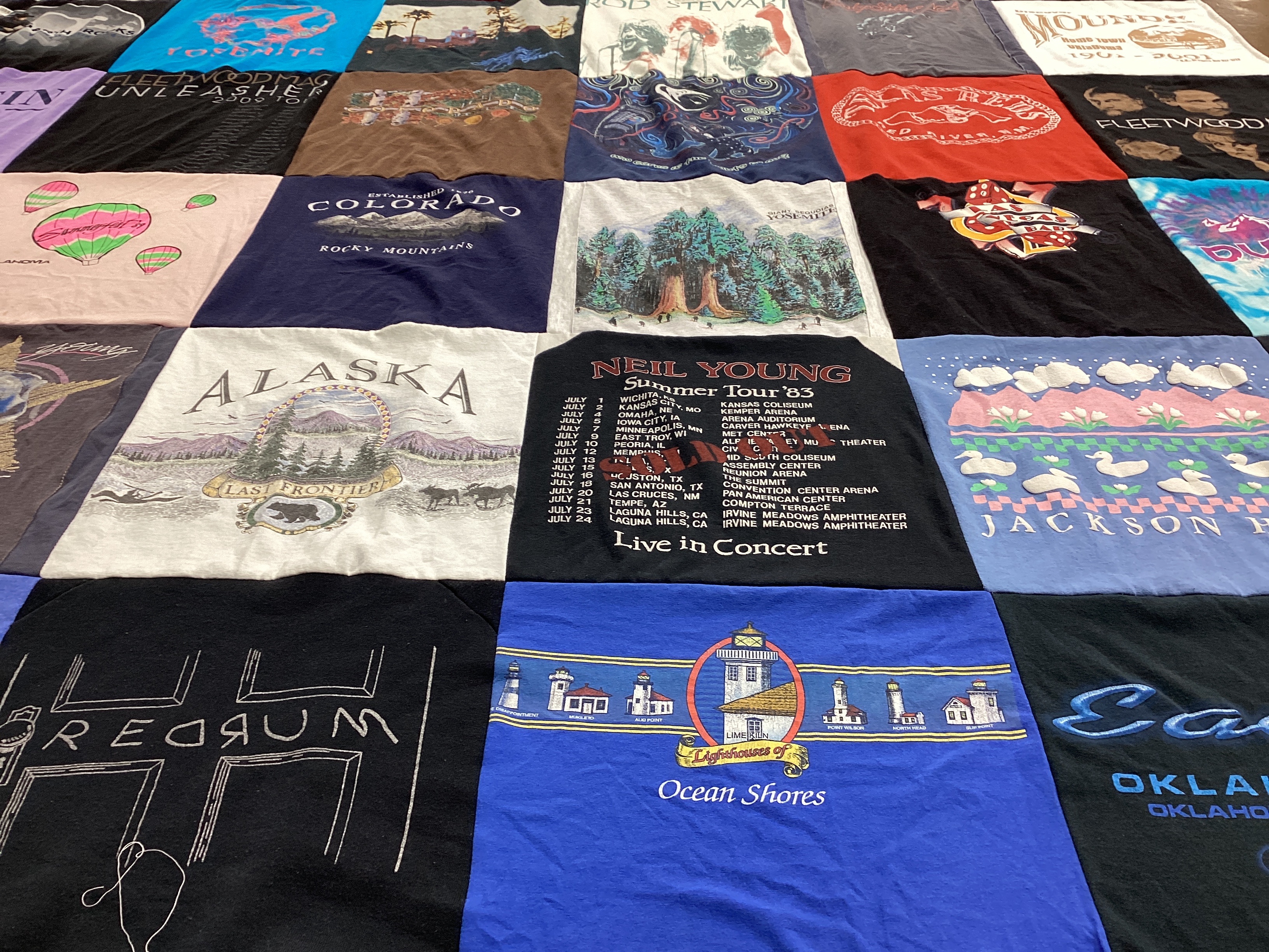 T-shirt quilt with travel, music themes by DeAwna from OK