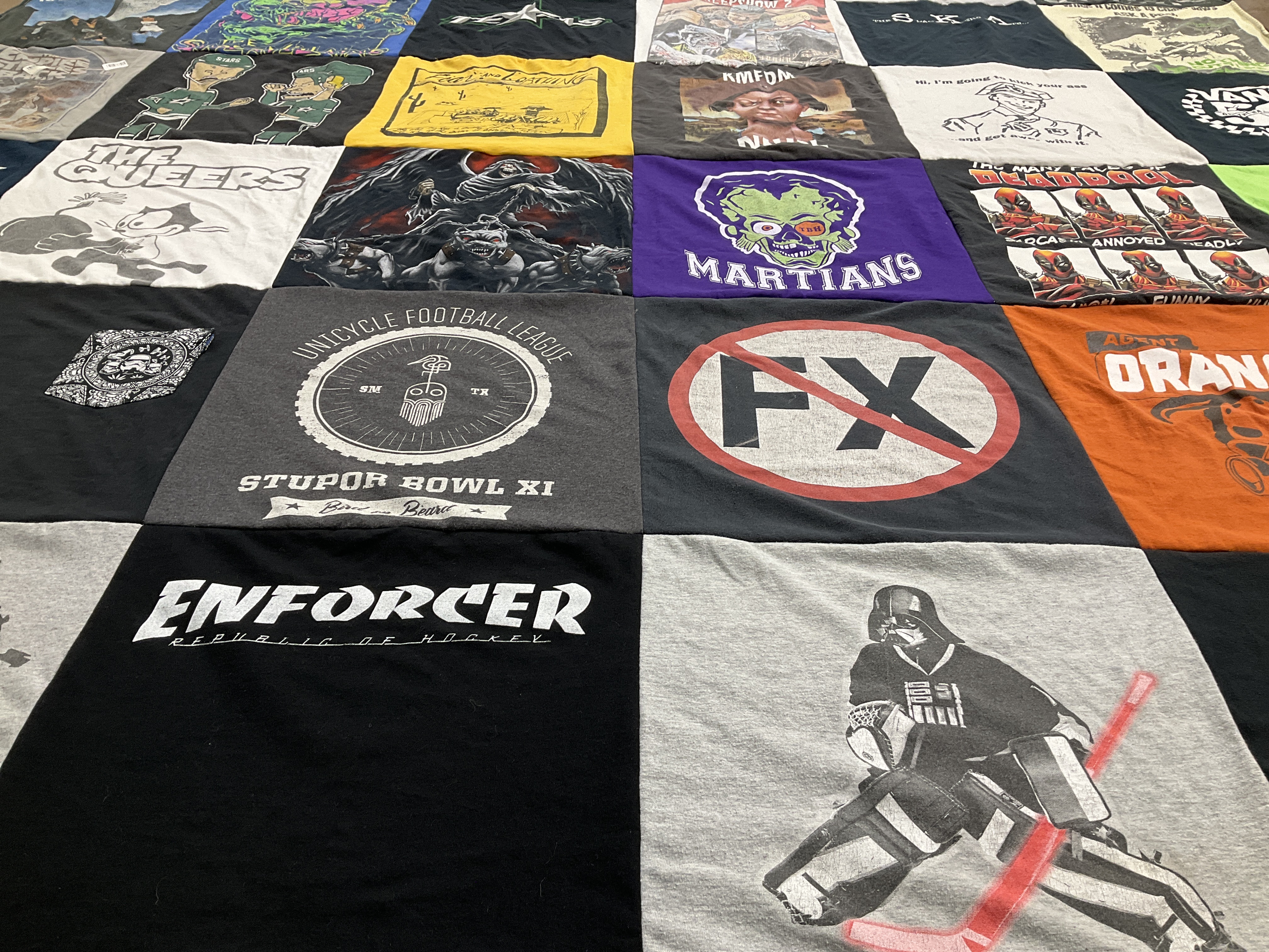 T-shirt quilt with hockey, football themes by Nicholas from TX