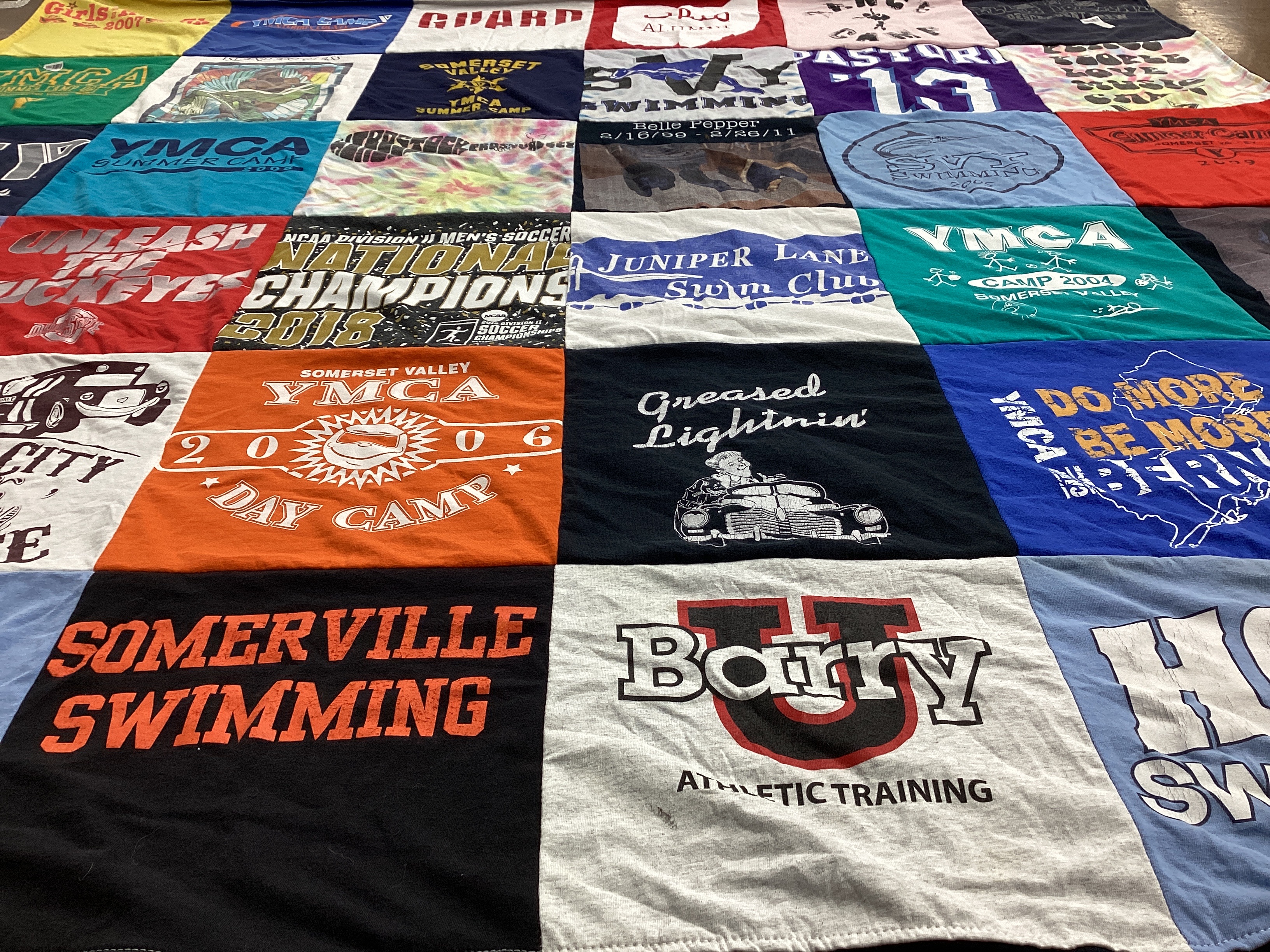 T-shirt quilt with swimming, summer camp themes by Kelly from NJ
