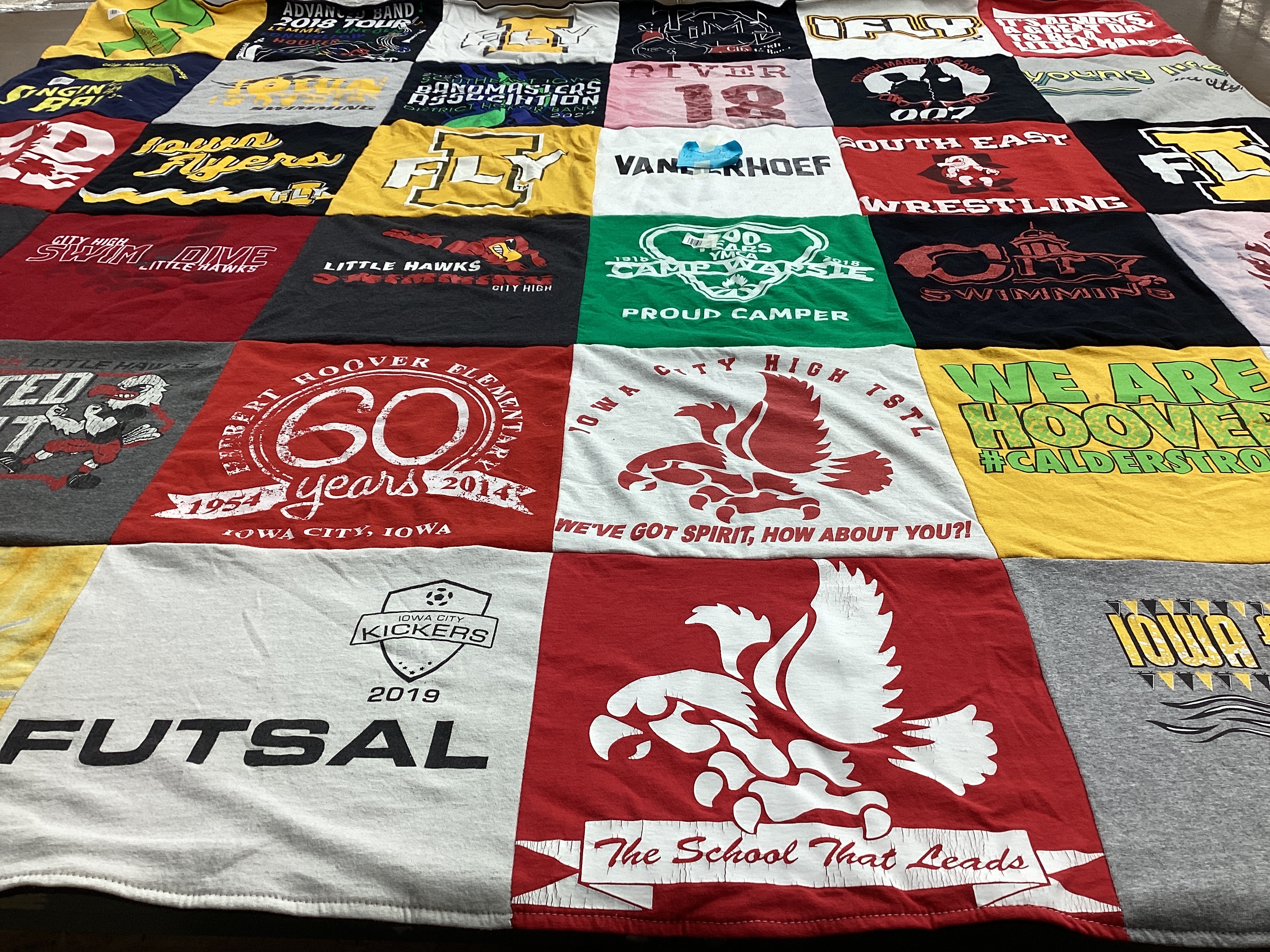T-shirt quilt featuring iowa city high school swim team, iowa city high school wrestling team by Jill from IA