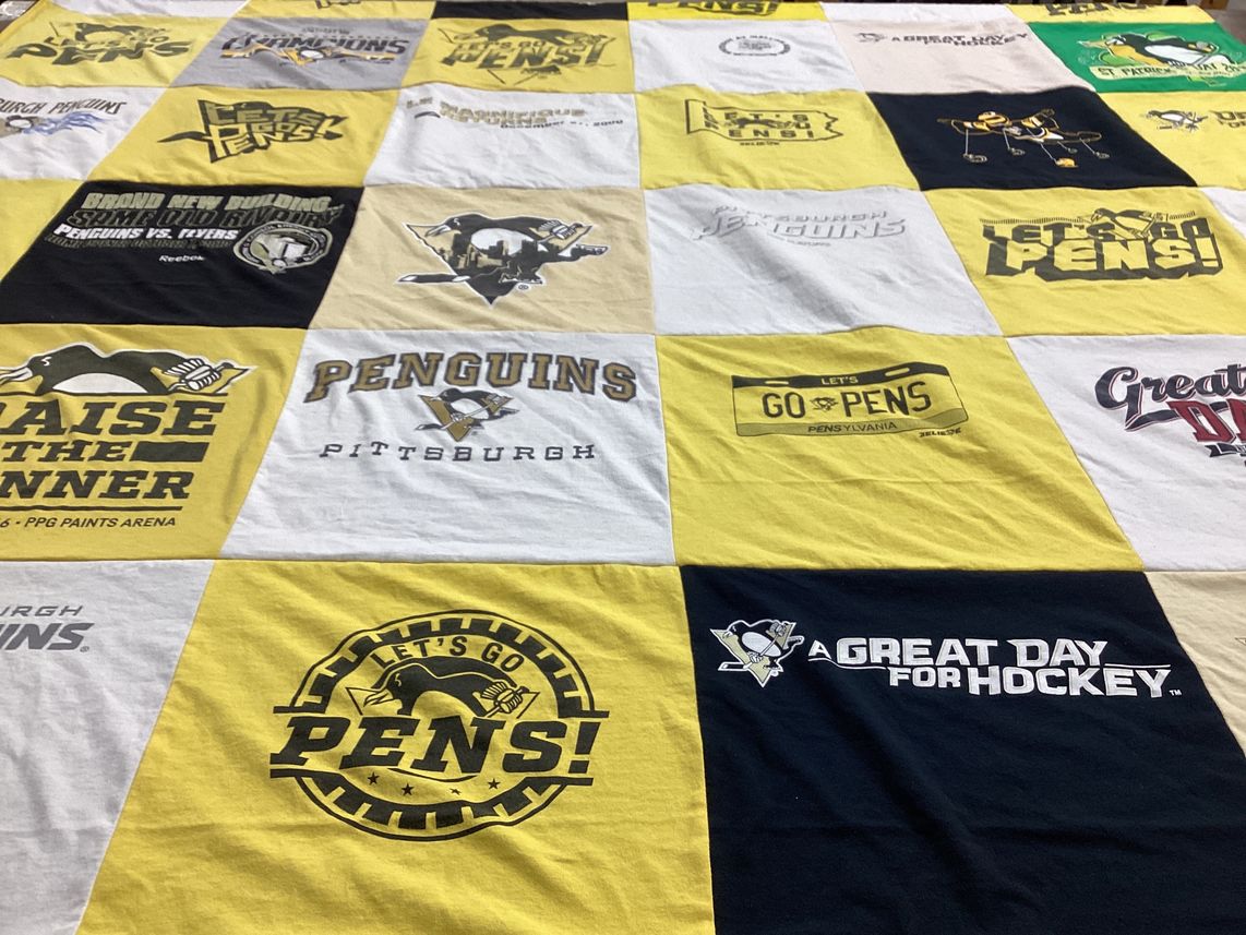 T-shirt quilt with hockey, sports themes by Patti from PA