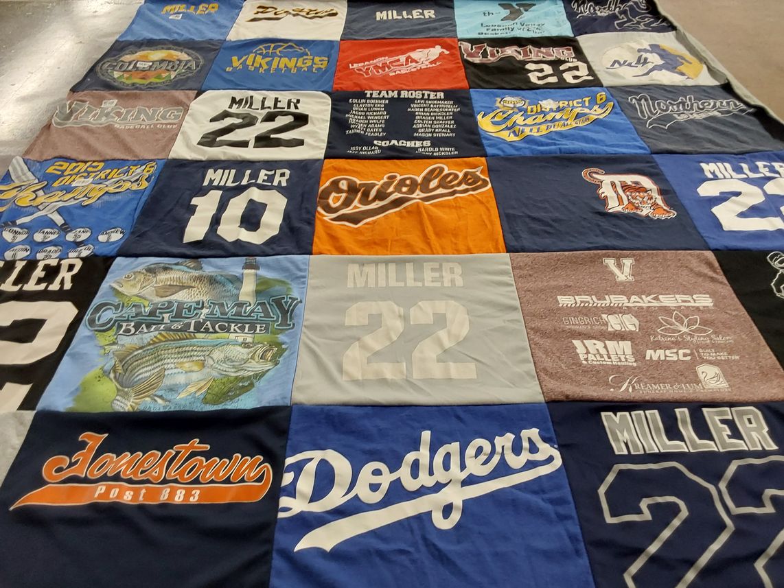 T-shirt quilt with sports, fishing themes by Kara from PA