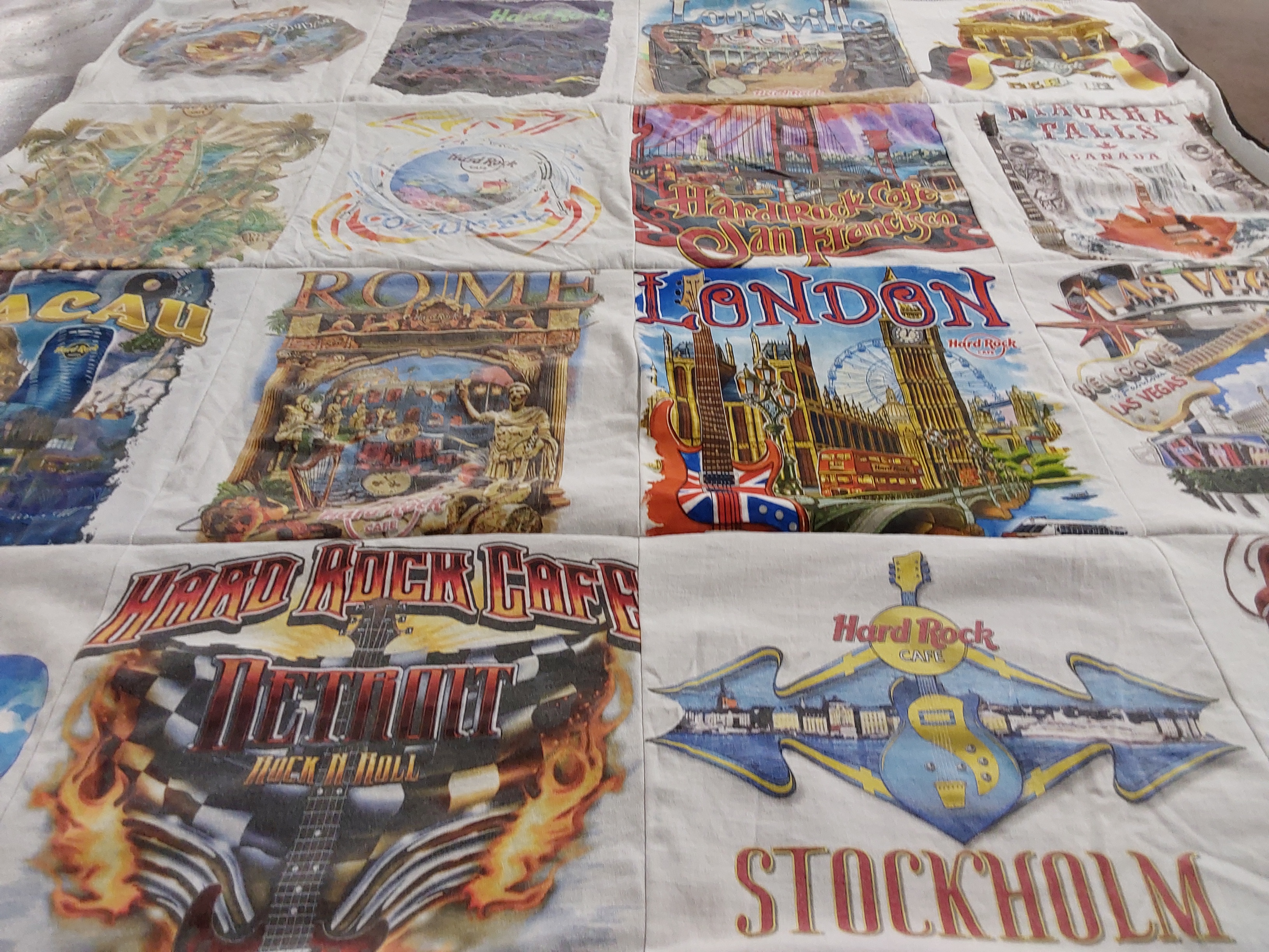T-shirt quilt with travel, music themes by Darlene from FL