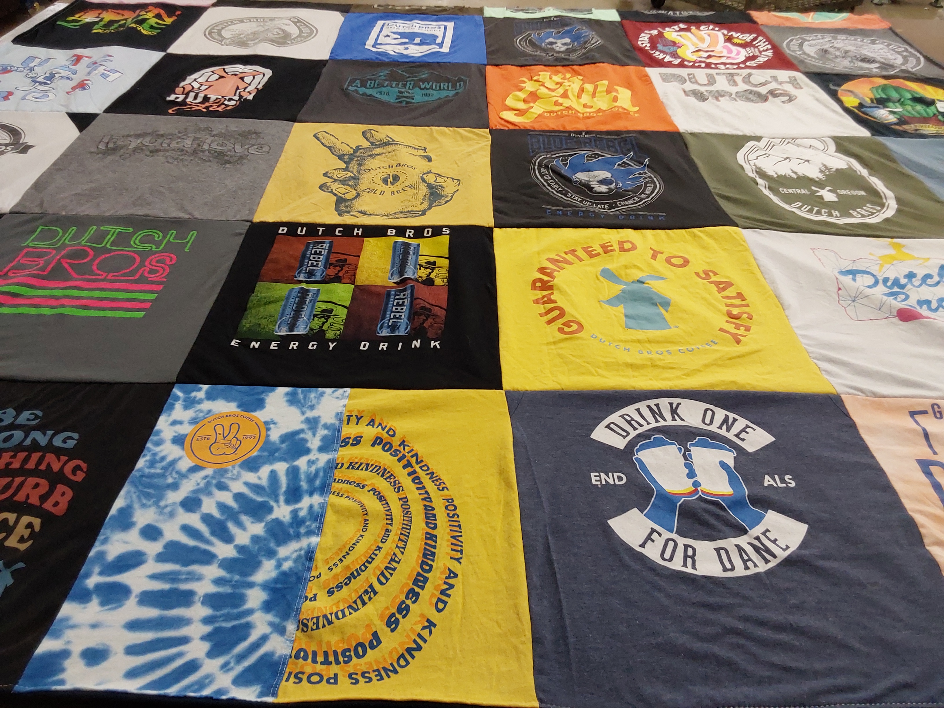 T-shirt quilt with coffee, energy drinks themes by Joan from WA