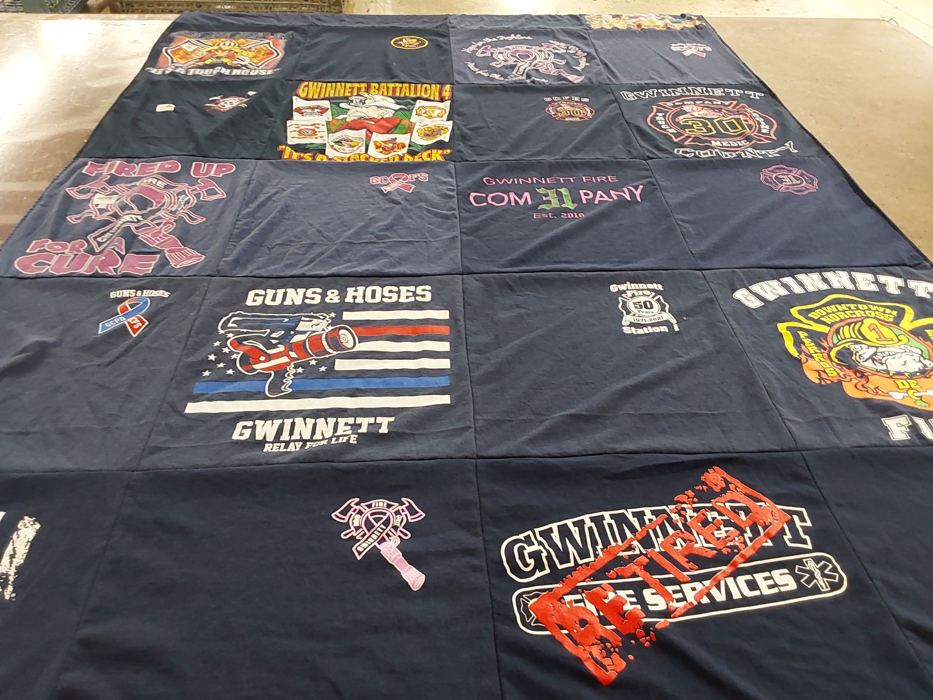 T-shirt quilt with firefighting, community service themes by Shannon from GA