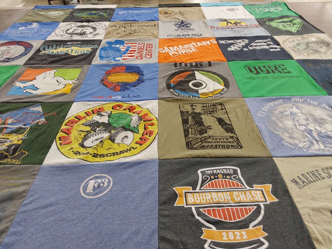 T-shirt quilt with running, outdoor themes by Faron from NC