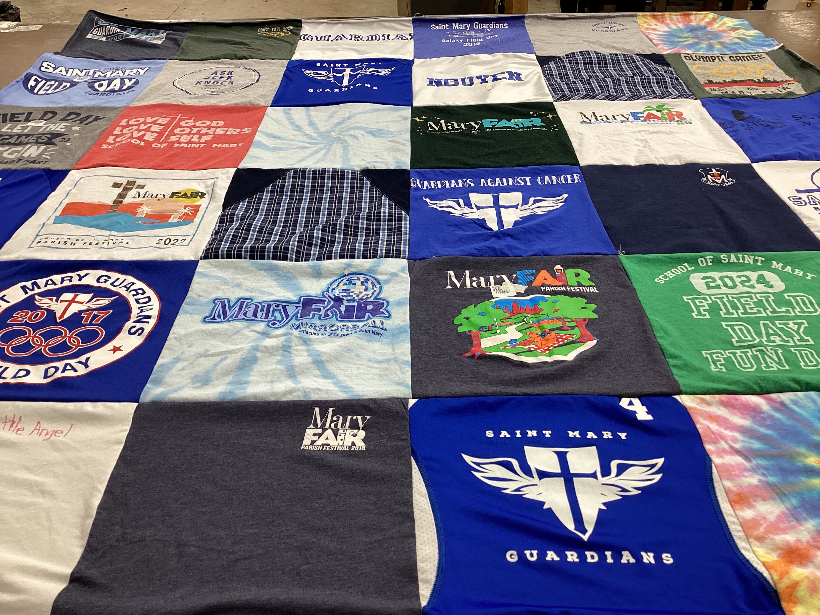 T-shirt quilt featuring saint mary guardians by Margrette from OK