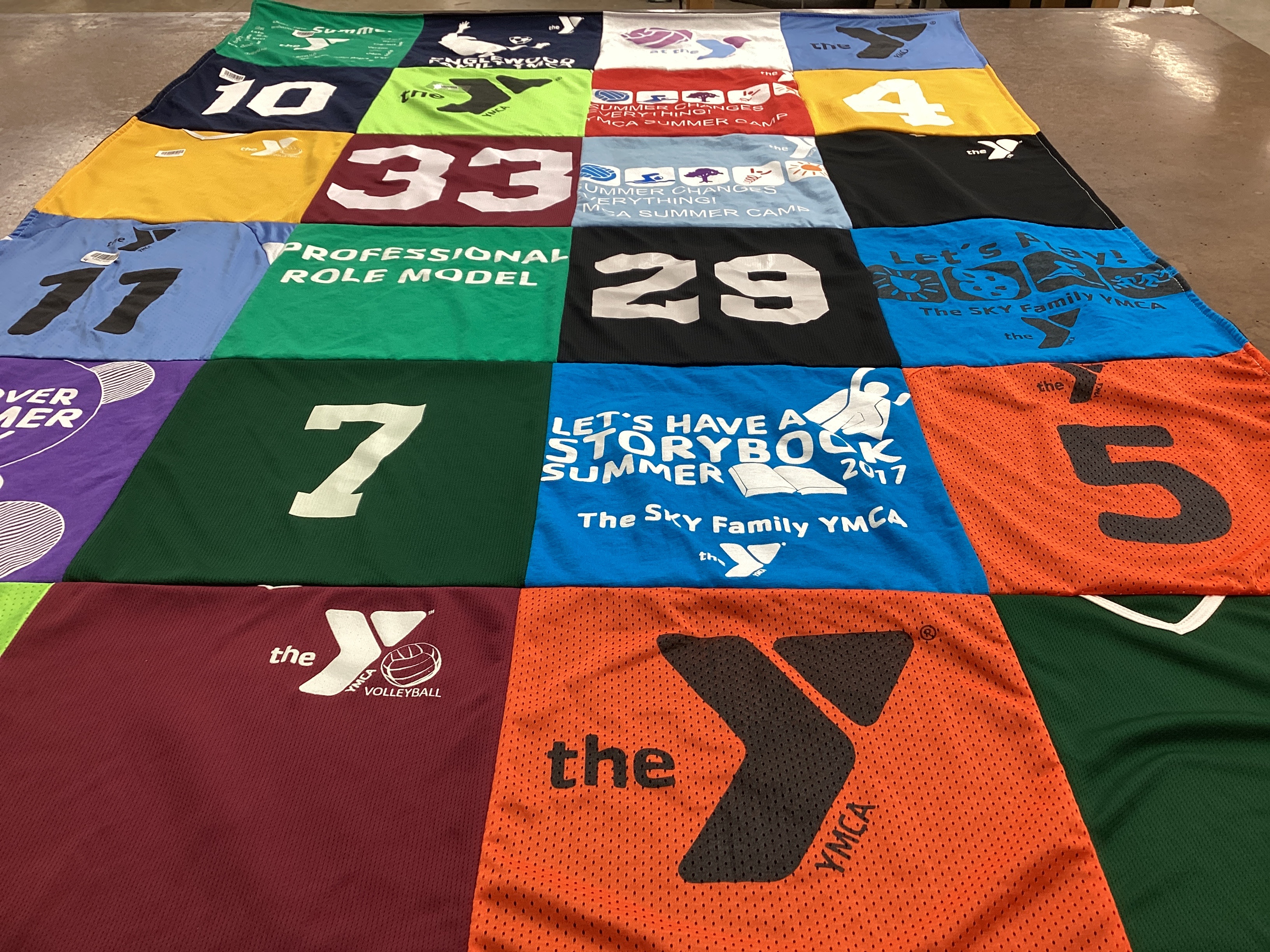 T-shirt quilt with sports, community service themes by Liz from FL