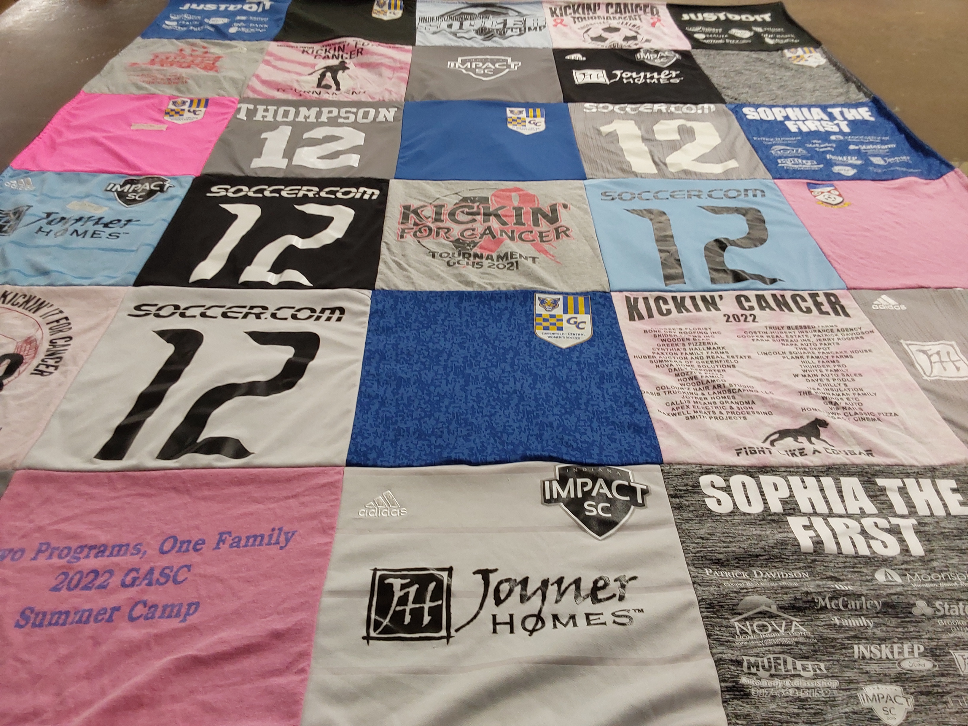 T-shirt quilt with soccer, cancer awareness themes by Emily from IN