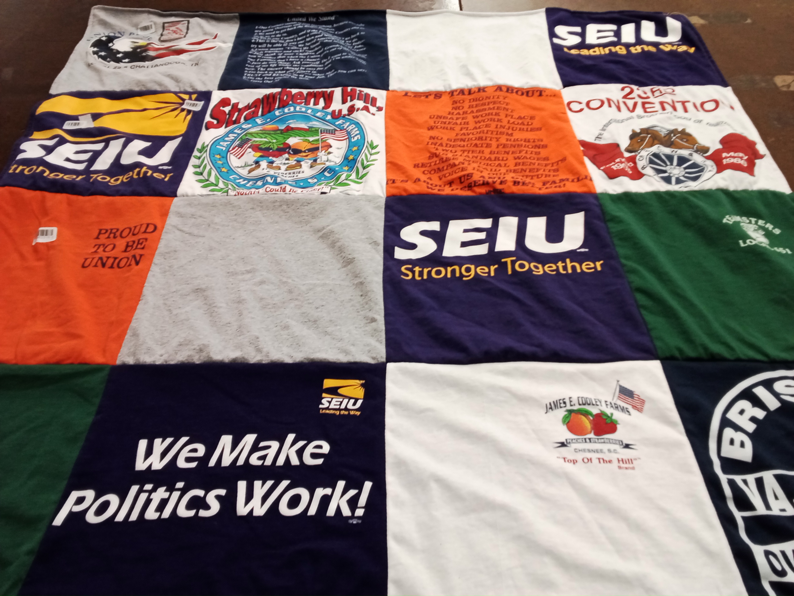 T-shirt quilt with labor rights, union activism themes by Brandy from NC