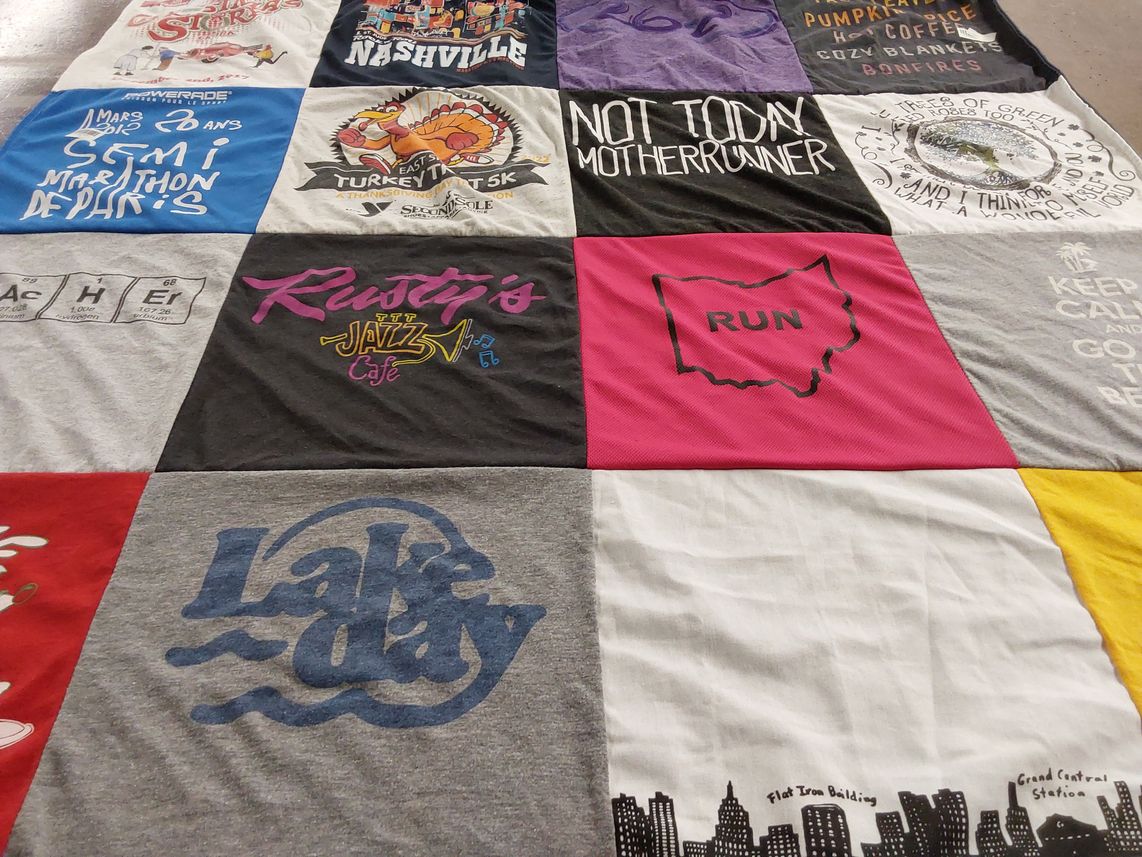 T-shirt quilt with running, cooking themes by Andrea from OH
