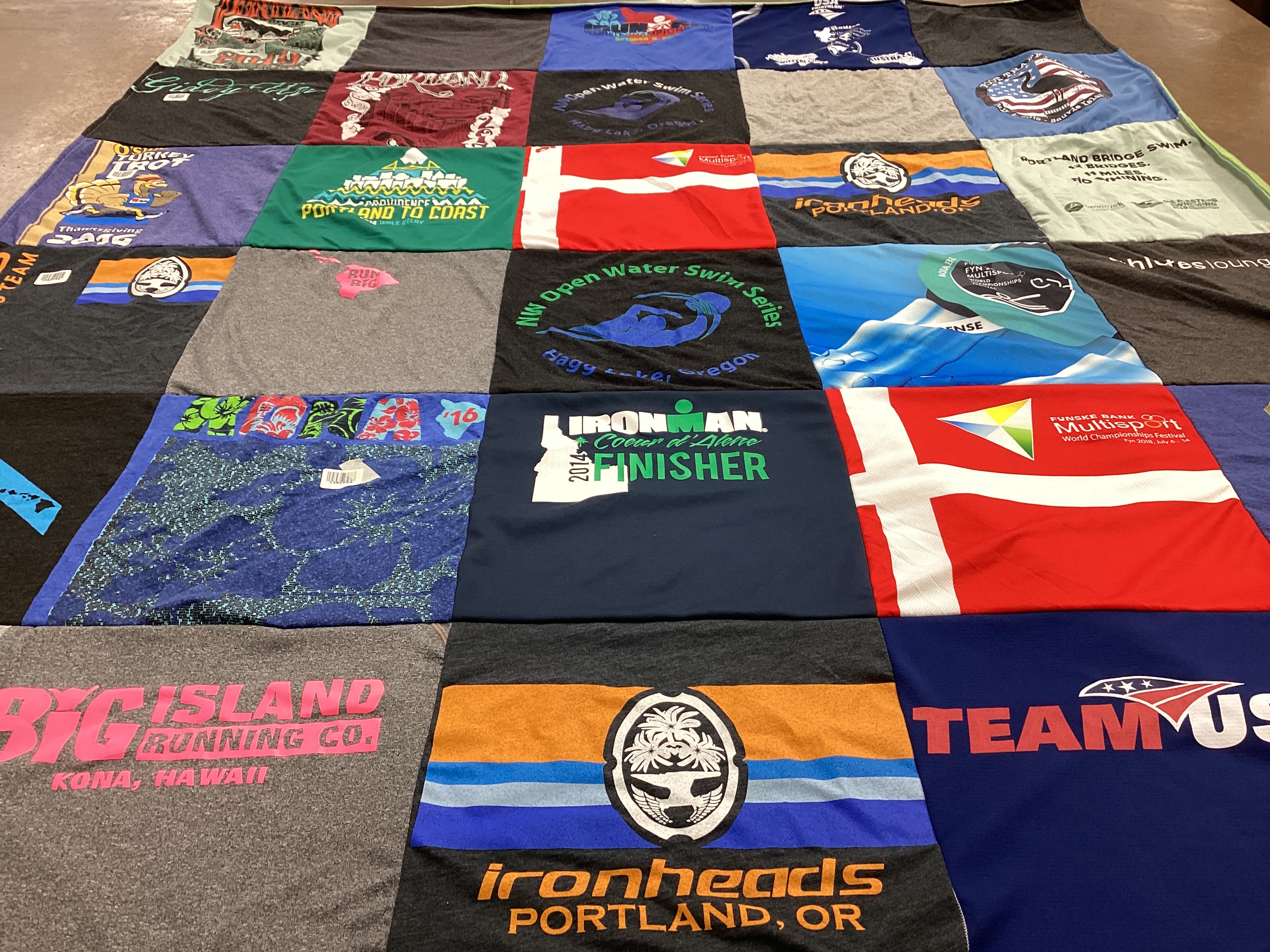 T-shirt quilt with running, swimming themes by Anita from OR