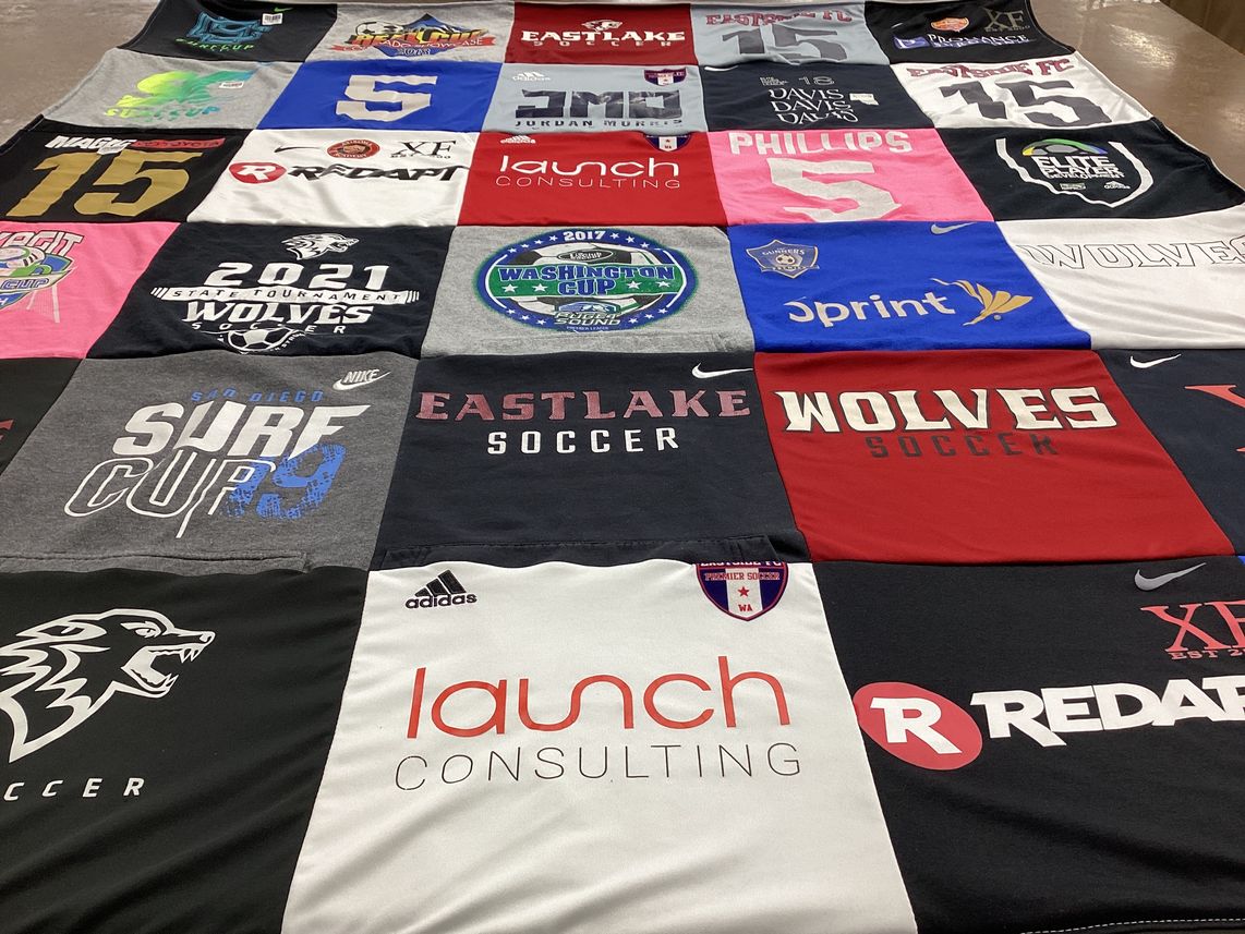 T-shirt quilt featuring eastlake high school football team, wolves soccer team by Angela from WA