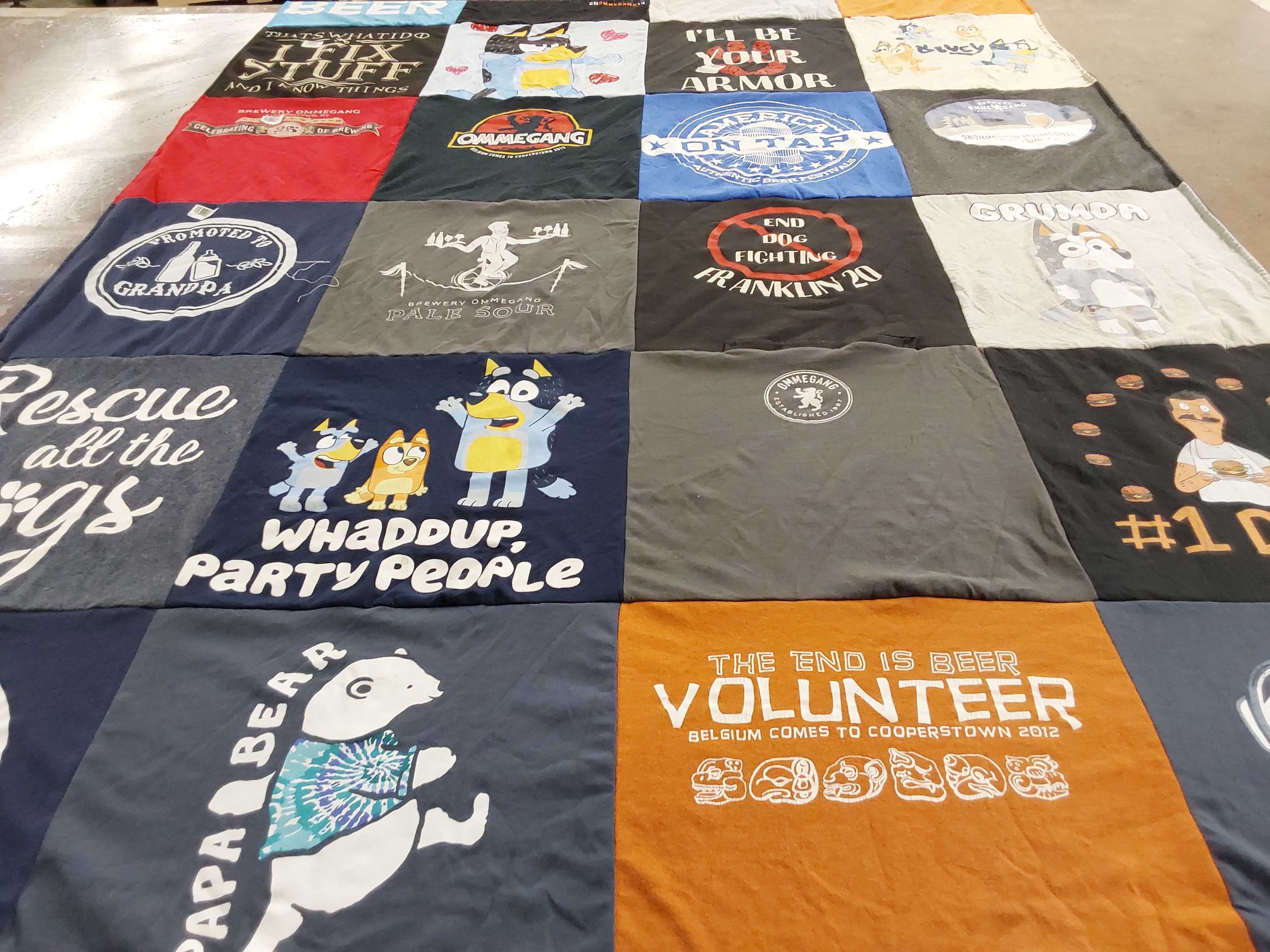 T-shirt quilt with breweries, dogs themes by Carol from NY