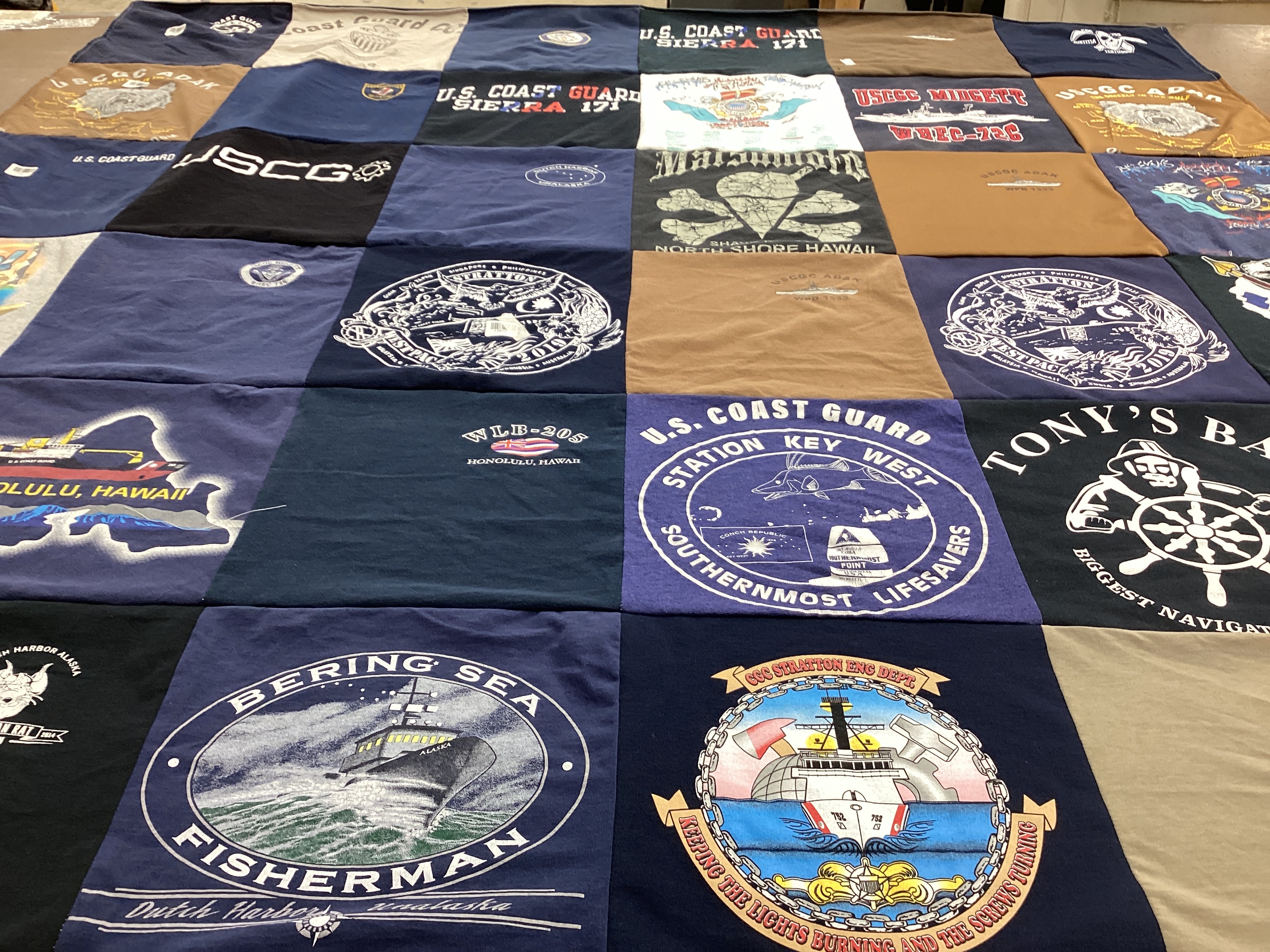 T-shirt quilt with fishing, coast guard themes by Natalie from MS