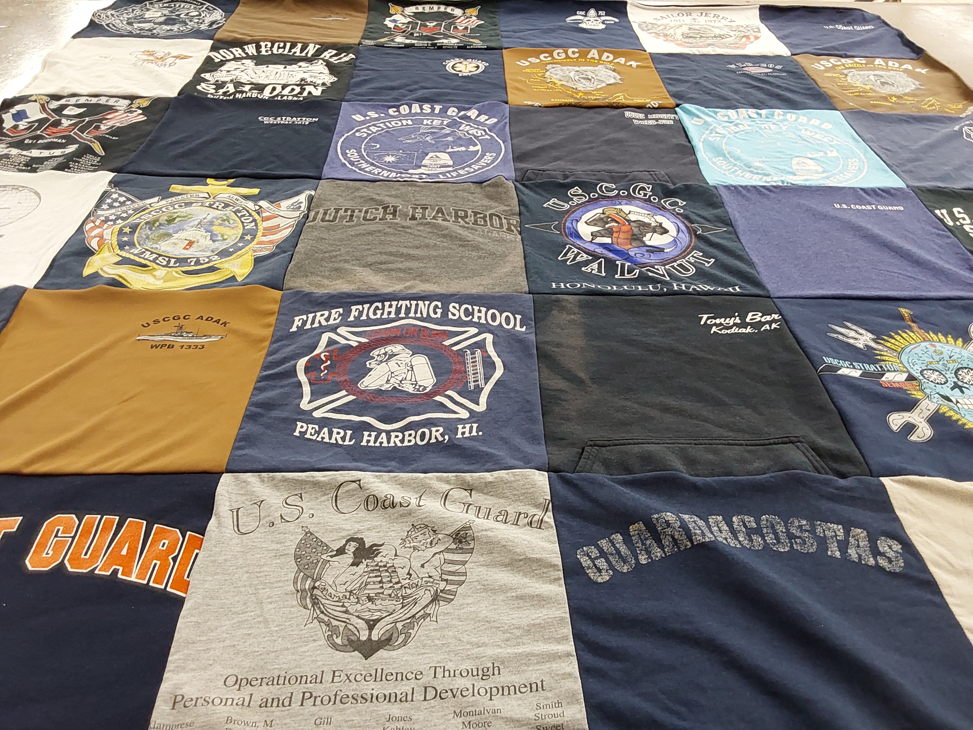 T-shirt quilt with coast guard, fire fighting themes by Natalie from MS