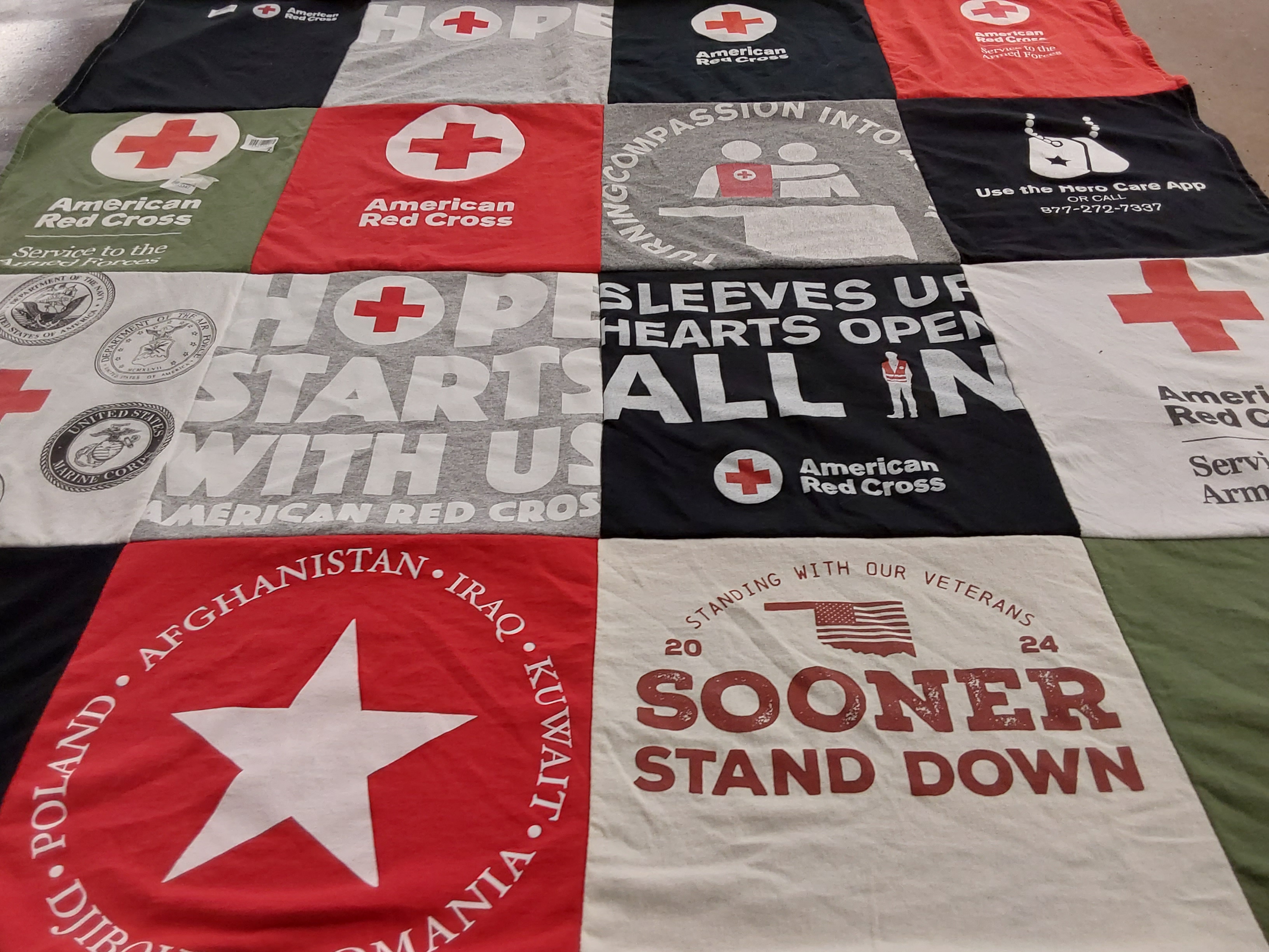 T-shirt quilt with veterans, humanitarian themes by Michelle from OK