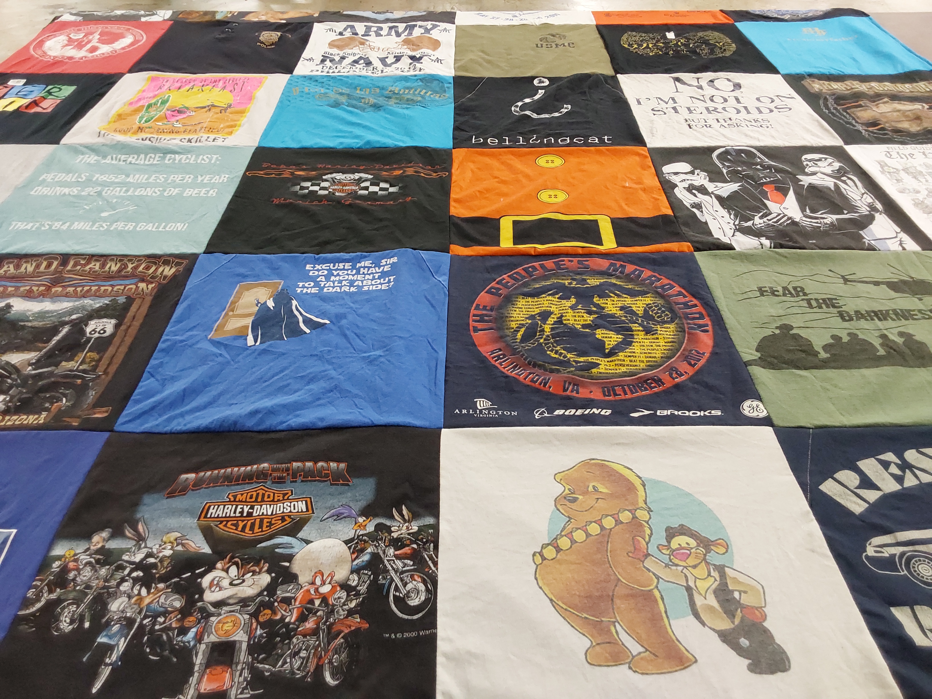 T-shirt quilt with cycling, motorcycling themes by Timothy from VA