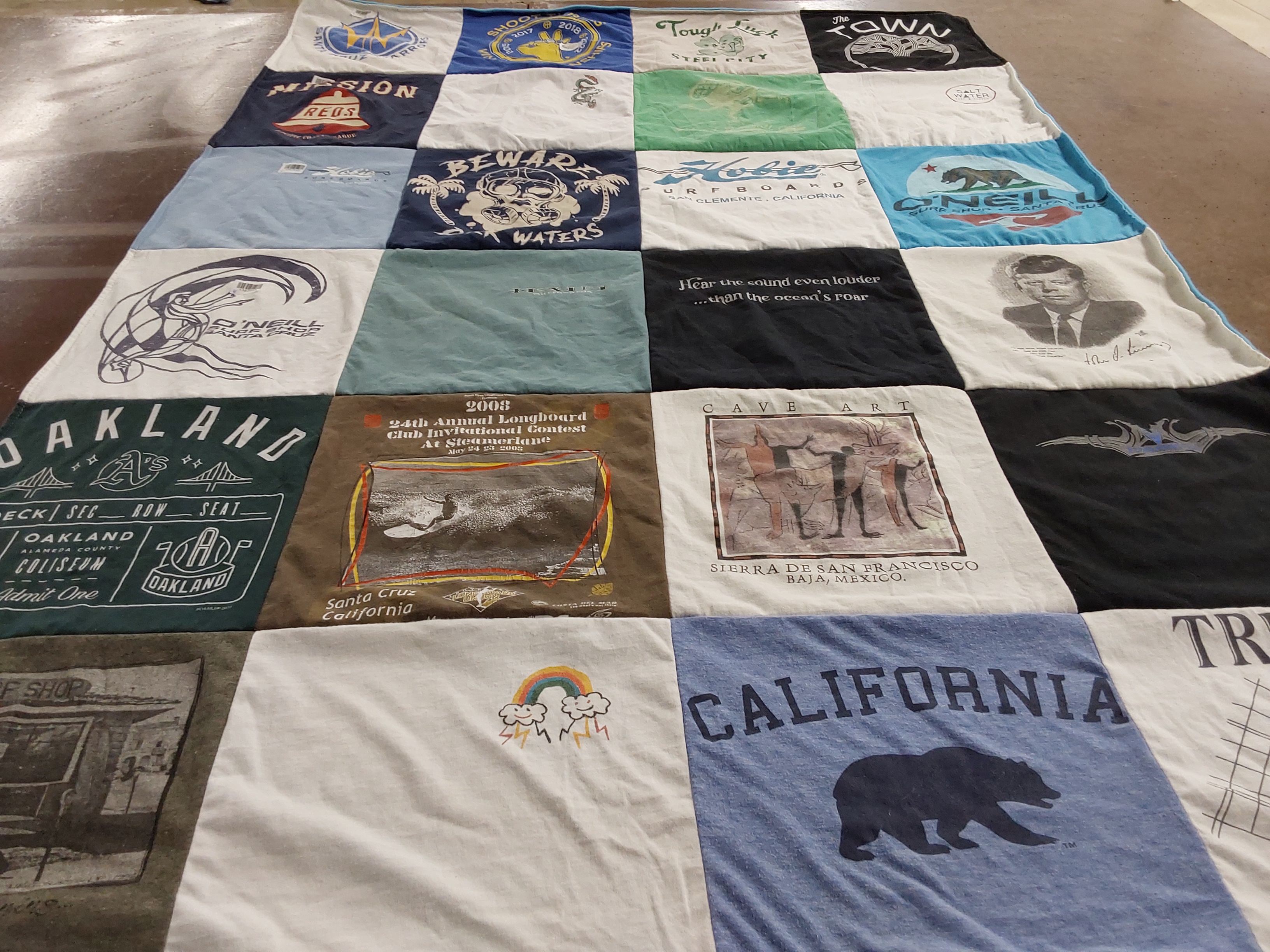 T-shirt quilt with surfing, sports themes by Laura from CA