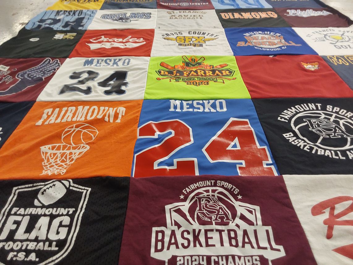 T-shirt quilt with basketball, football themes by Rachel from PA