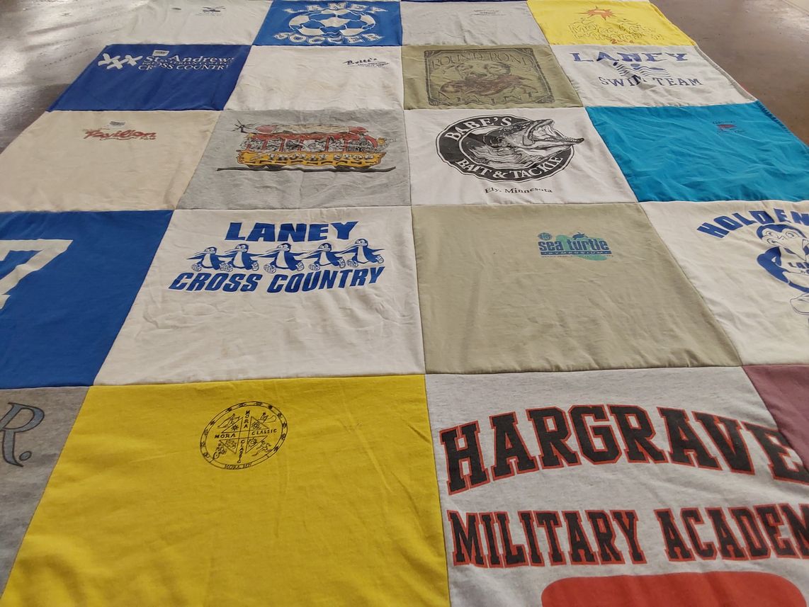 T-shirt quilt featuring laney swim team, laney cross country by Keith from NC
