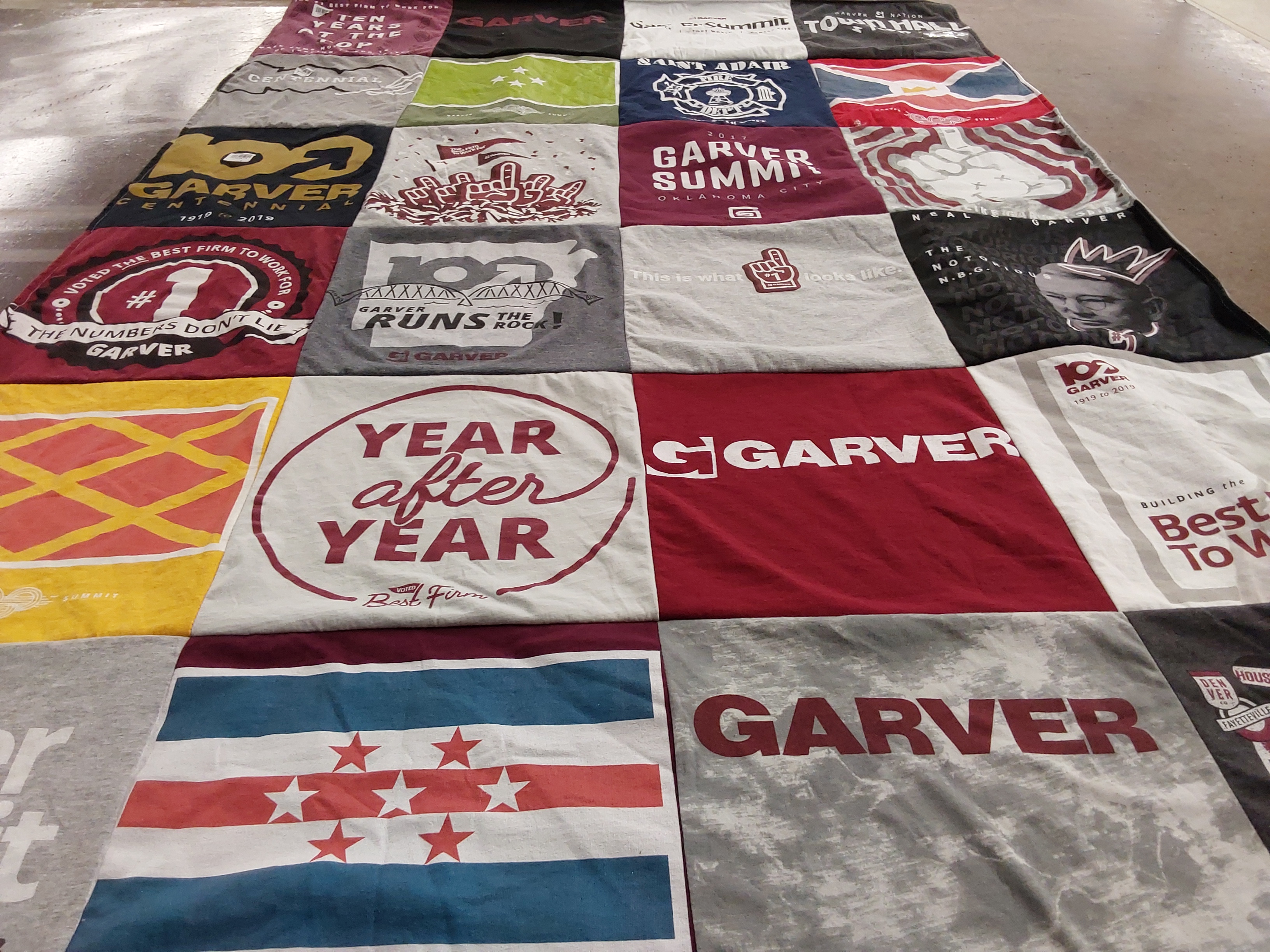 T-shirt quilt with business, community themes by Julie from AR