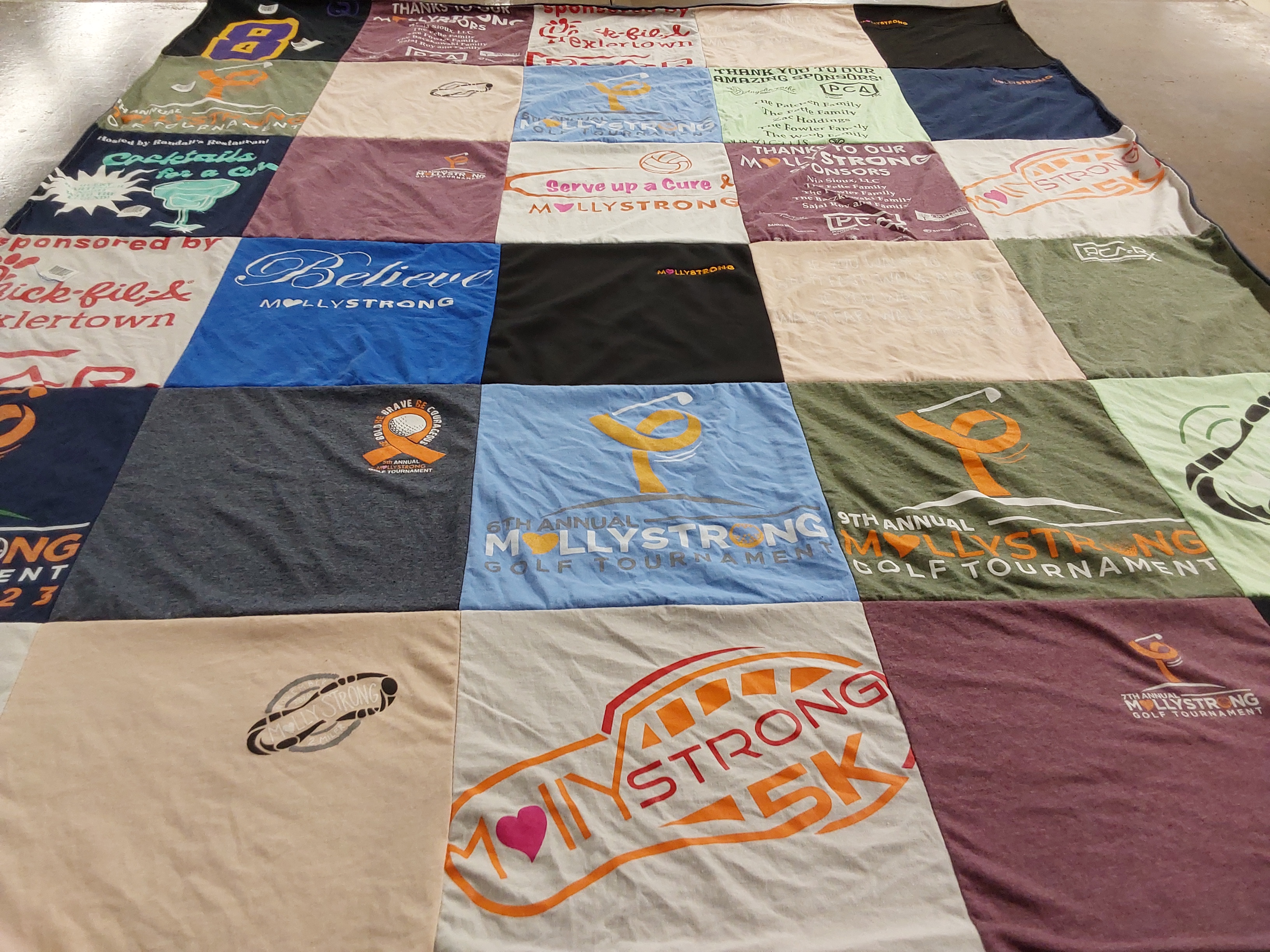 T-shirt quilt with golf, charity themes by jeanne from PA