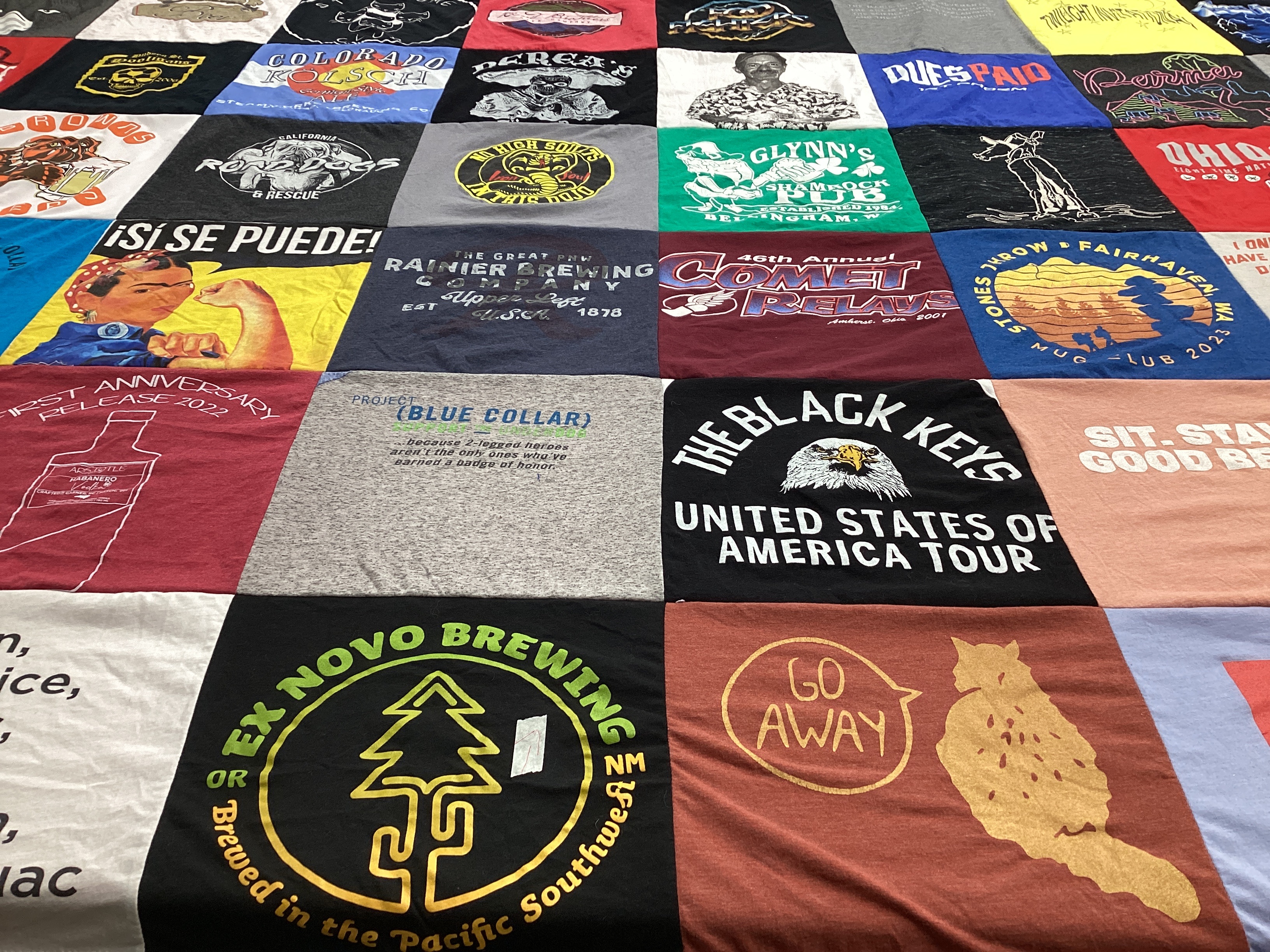 T-shirt quilt with feminism, music themes by Lauren from CO