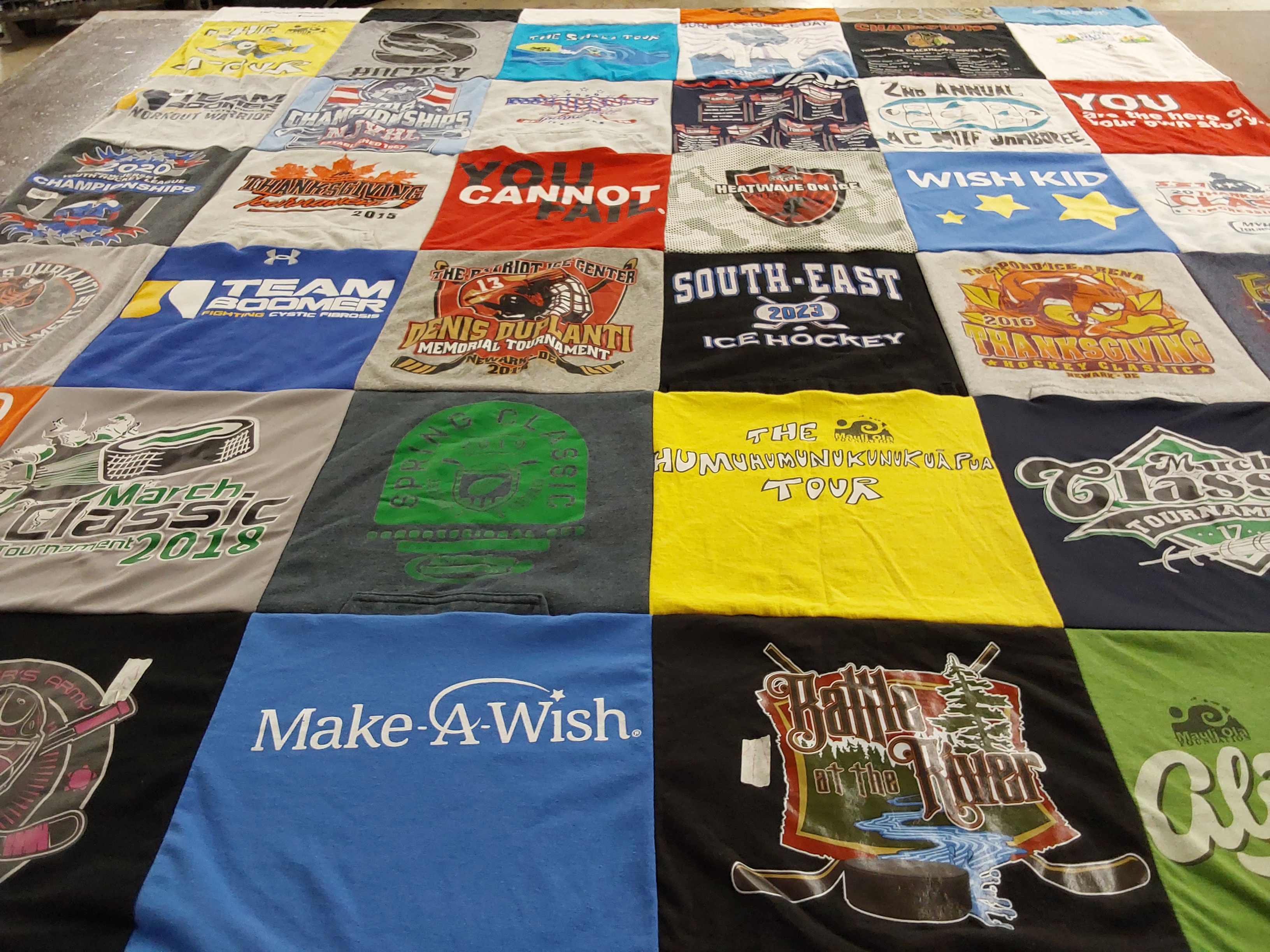 T-shirt quilt with ice hockey, tournaments themes by Laura from NJ